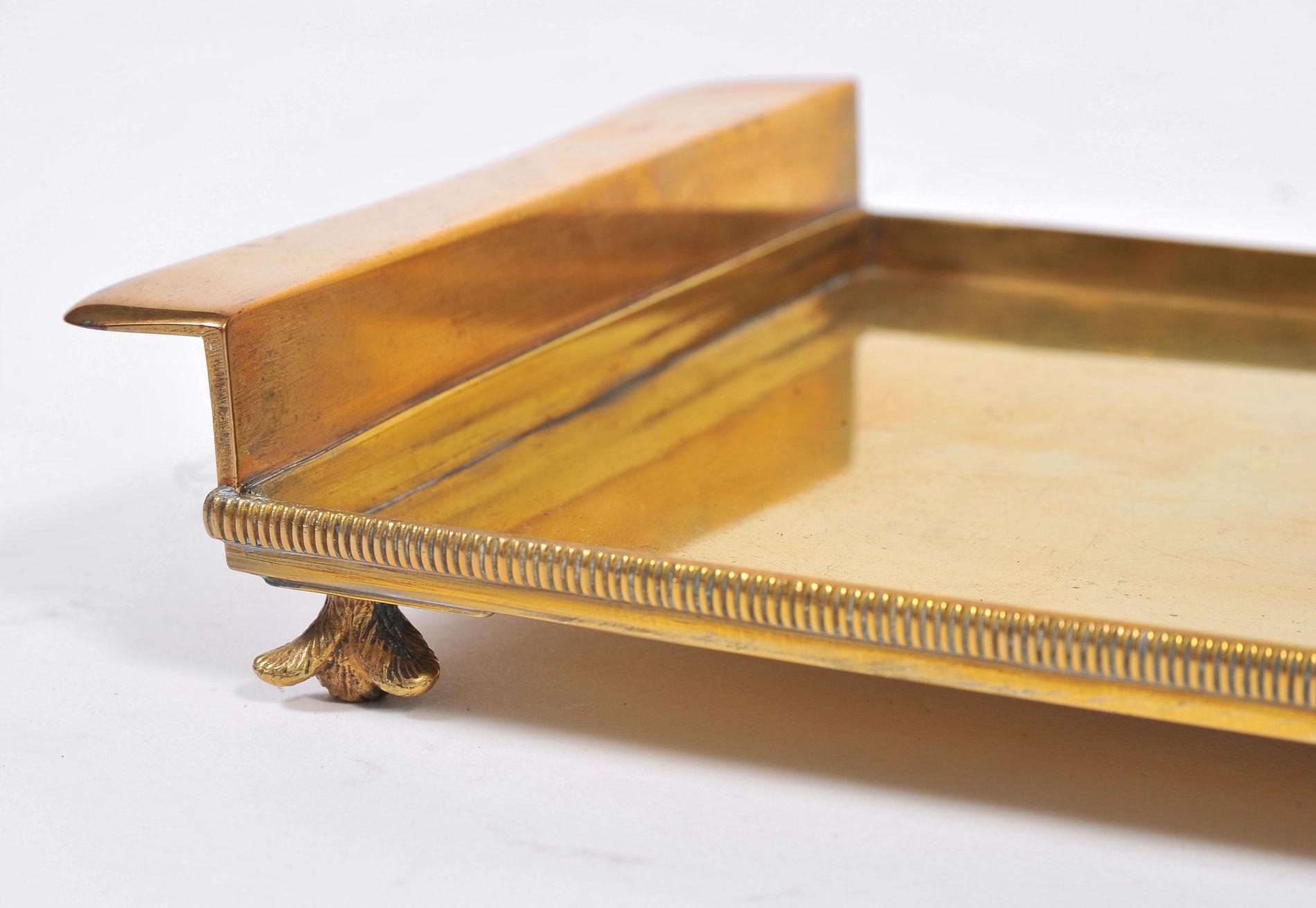 Occasional solid brass tray with decorative flower-bud feet, delicately ribbed sides and shaped handles.