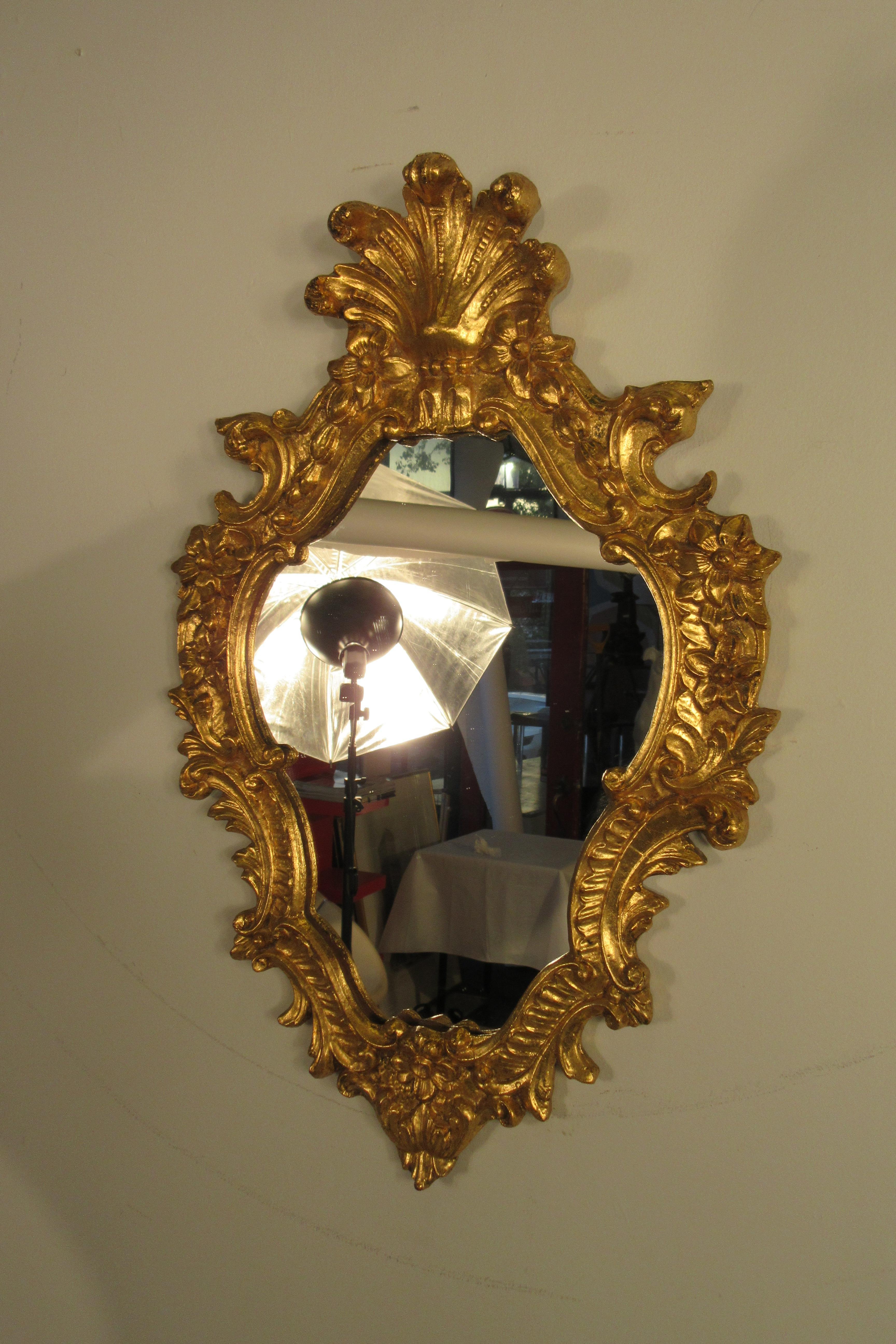 1950s Italian carved wood gilt mirror.
This item can be shipped UPS.