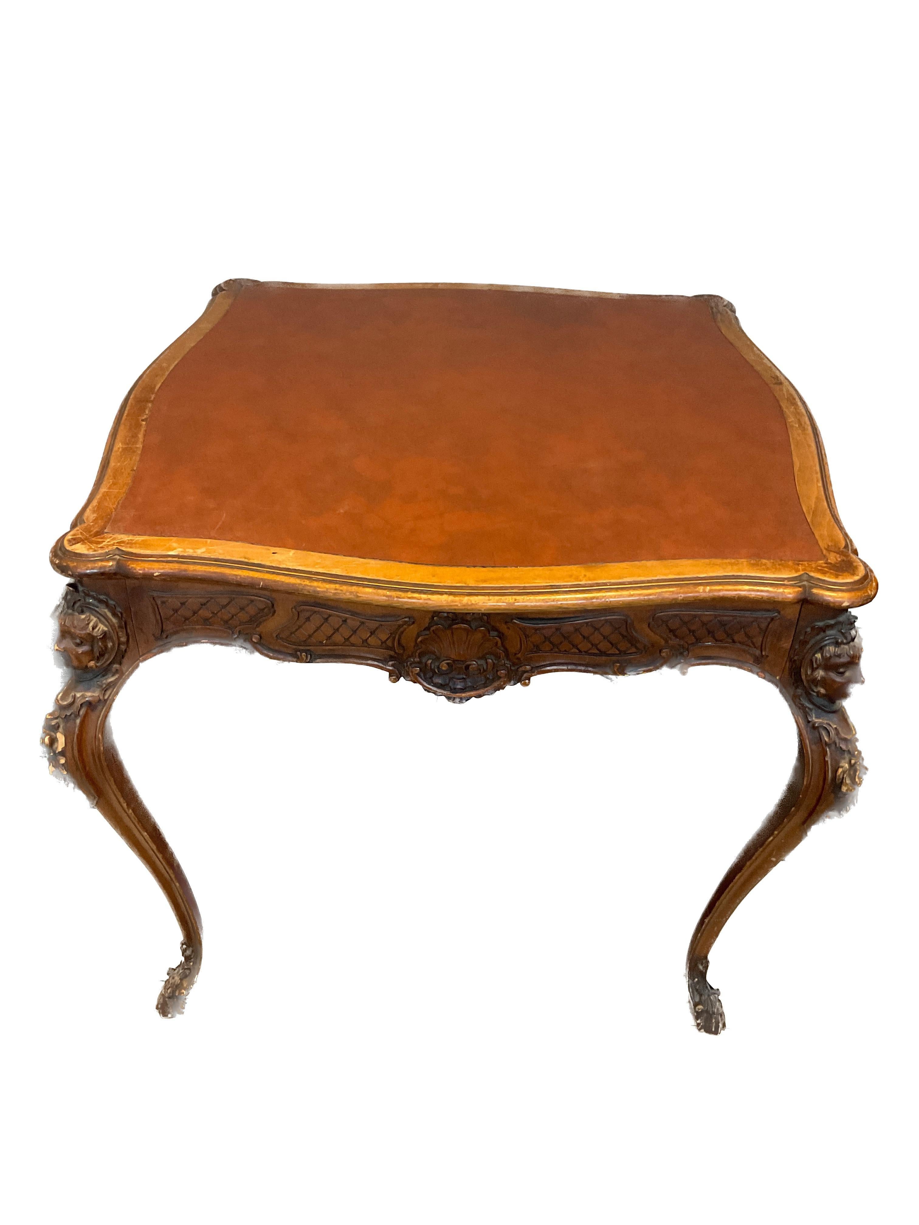 1950s Carved wood Rococo game table. Leather top. Made in Italy. Used on the TV show The Marvelous Mrs. Maisel.