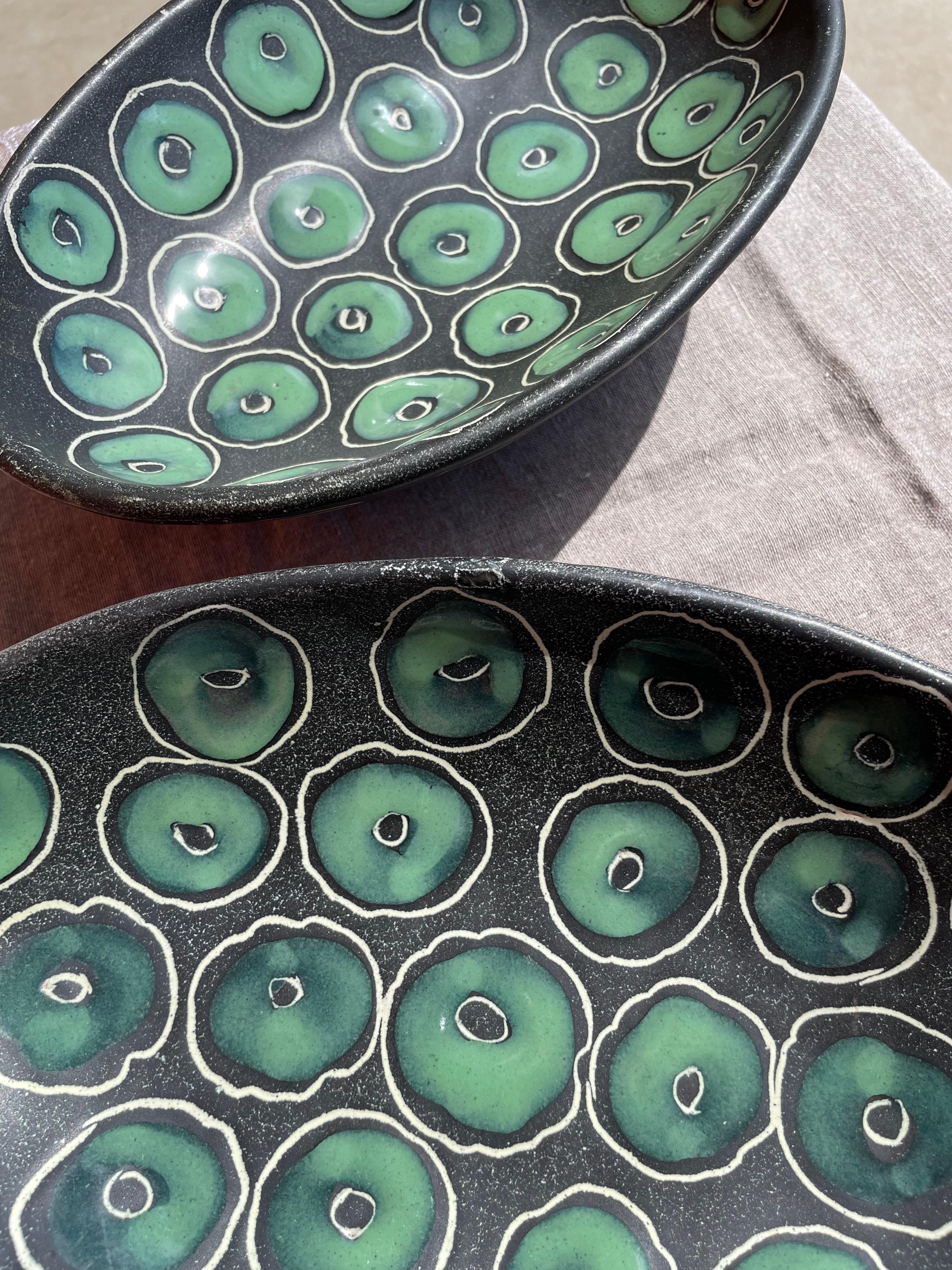 These 1950s Italian Ceramic Bowls are expertly crafted, being as they are strong and smooth. The piece was hand molded and hand painted. The design is organic and flowing, the paint rises ever so slightly to give a soft texture to the bowl. Italy in