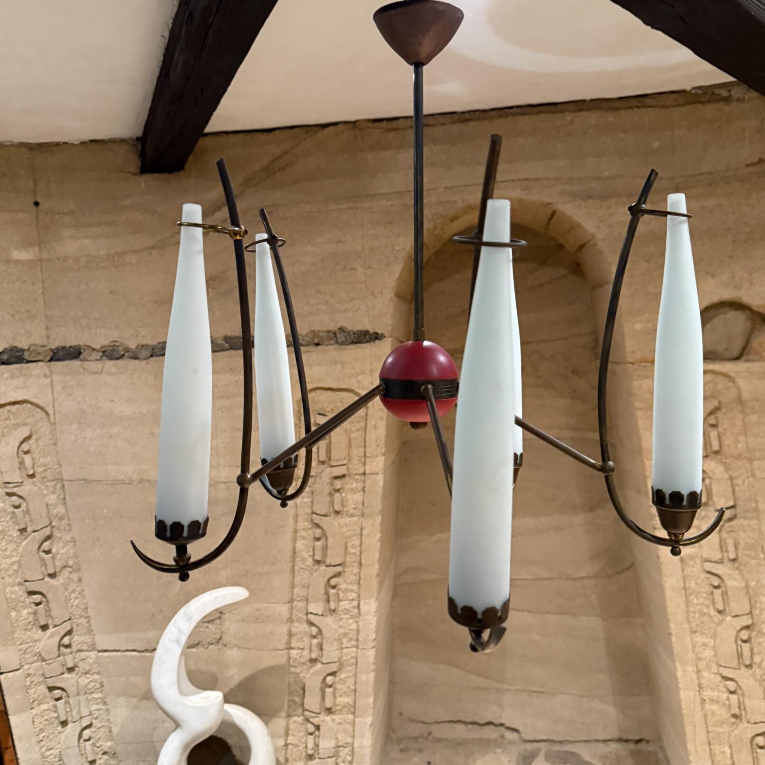 For your consideration a 1950s Italian Brass Chandelier sculptural aluminum arms 
hardware painted red
five handmade opaline case glass shades
Unmarked attributed Stilnovo
It requires five E14 bulbs not included
21.5 h x 24 diameter
Original vintage