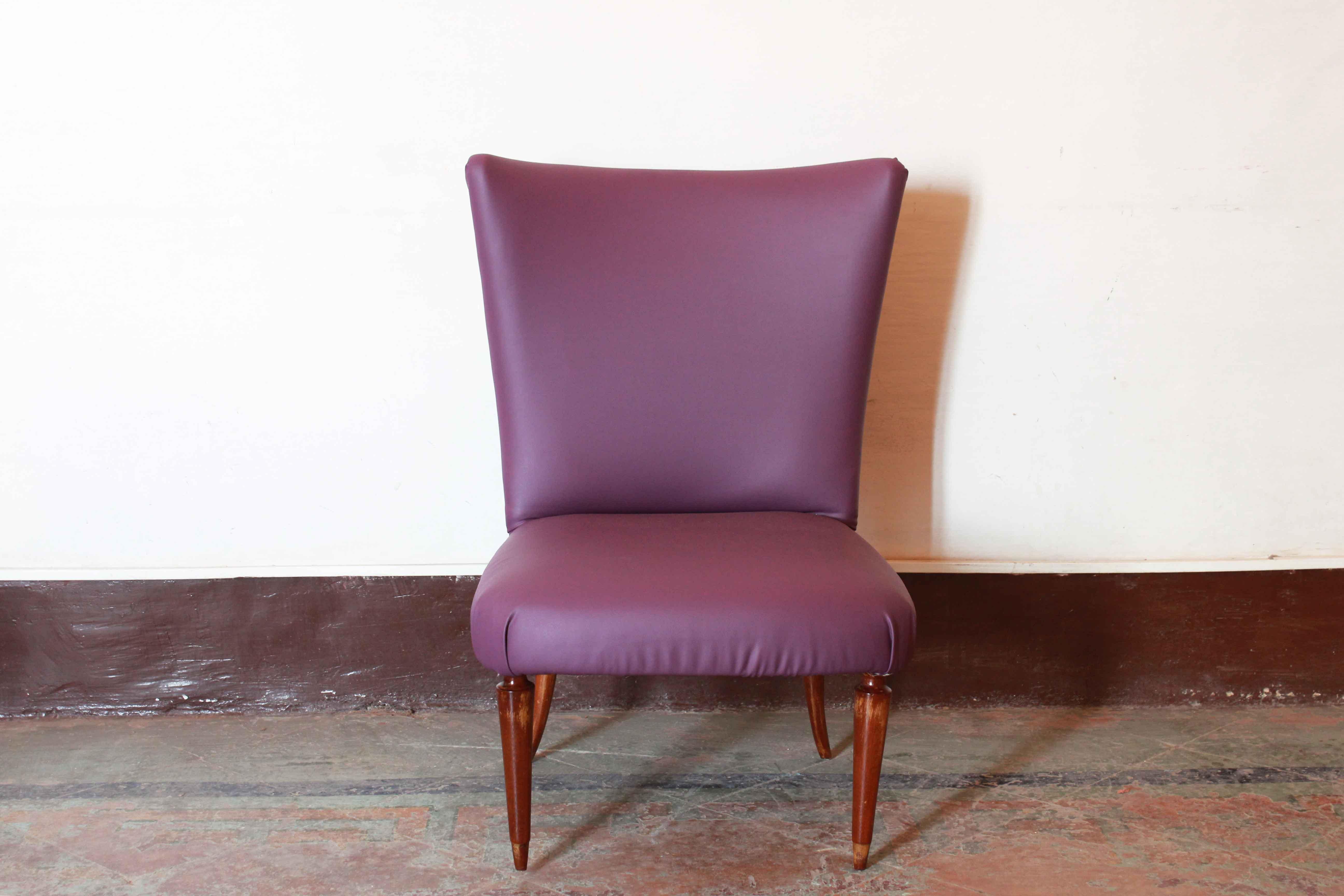 A Pop restyle made on two 1950s Italian vintage corner chairs colored leatherette (pink and purple) has been added on original structure. The wood parts have been polished and cleaned and the structure seats renovated.