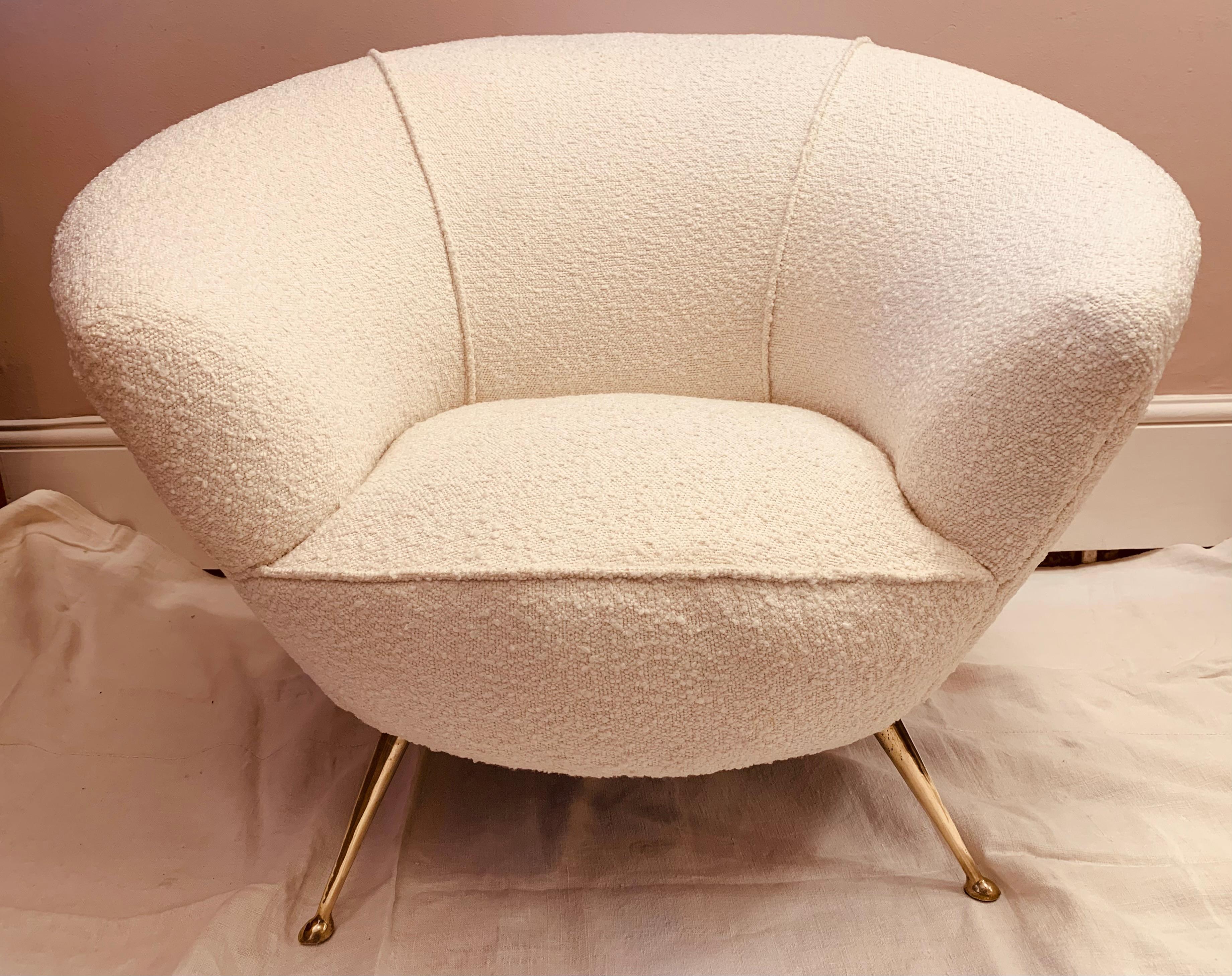 1950s original Italian Tub armchair with wonderful curved lines and splayed, tapered, polished brass legs in the style of Gio Ponti. Very comfortable and newly reupholstered in white boucle. The armchair is designed for comfort with heavily padded