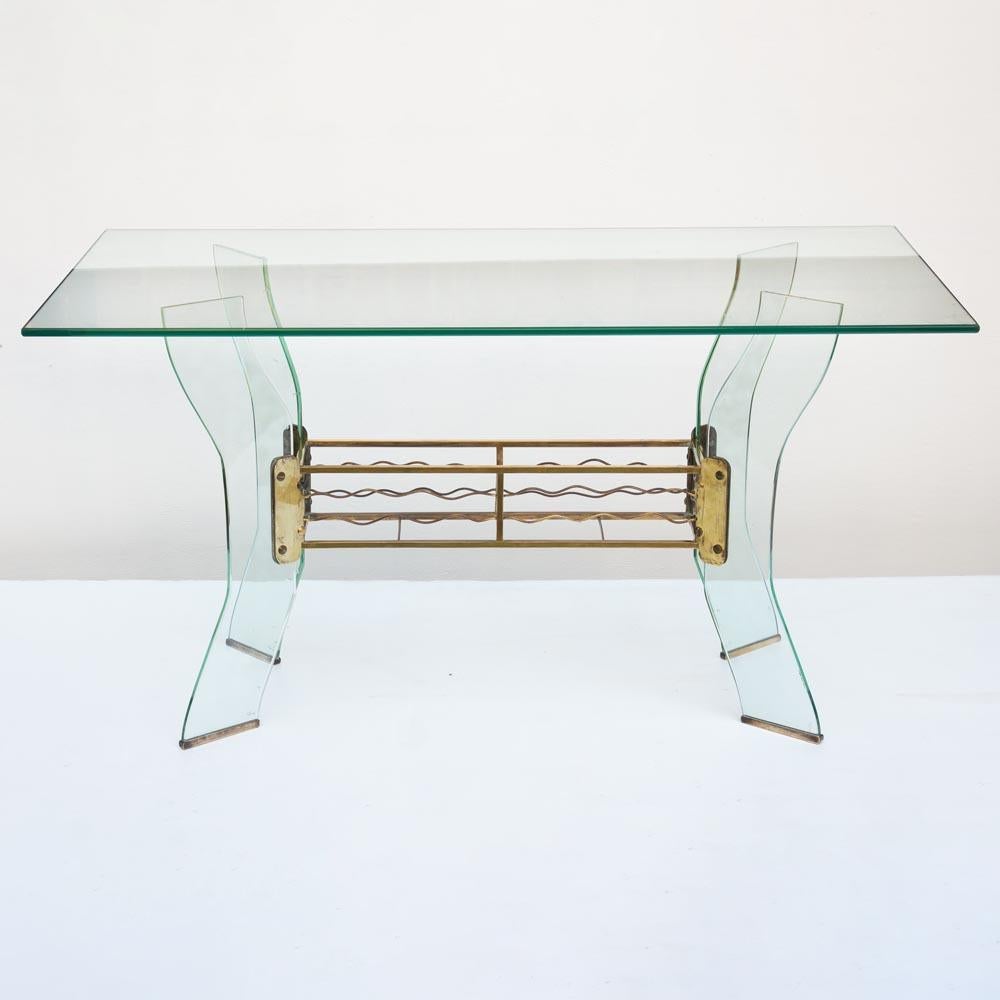 1950s Italian design rectangular coffee table features a glass structure held together by brass metal frame. The design is attributed to Luigi Brusotti for Fontana Arte.