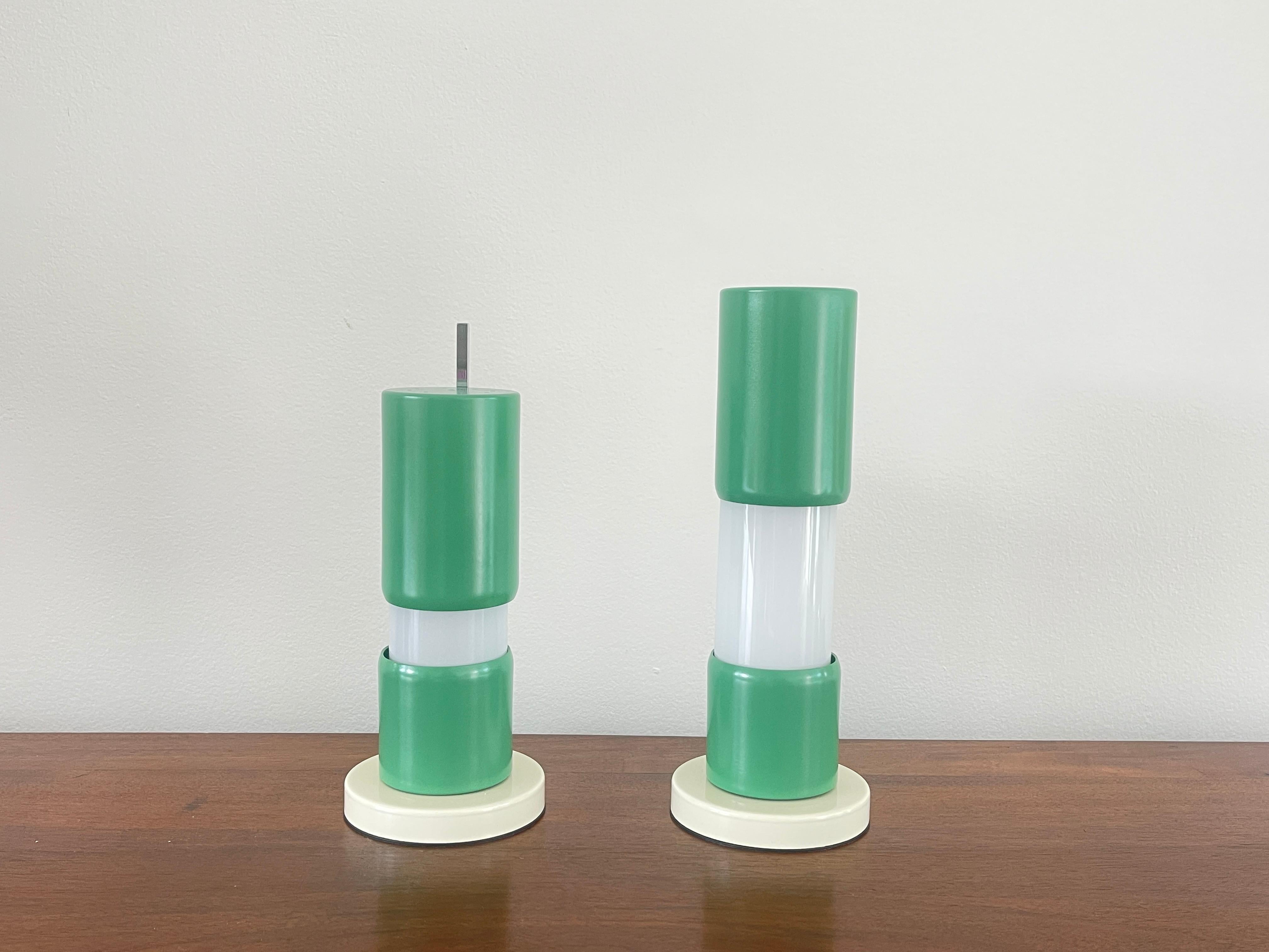 Italian desk lamps in playful green color with moveable sliding columns.