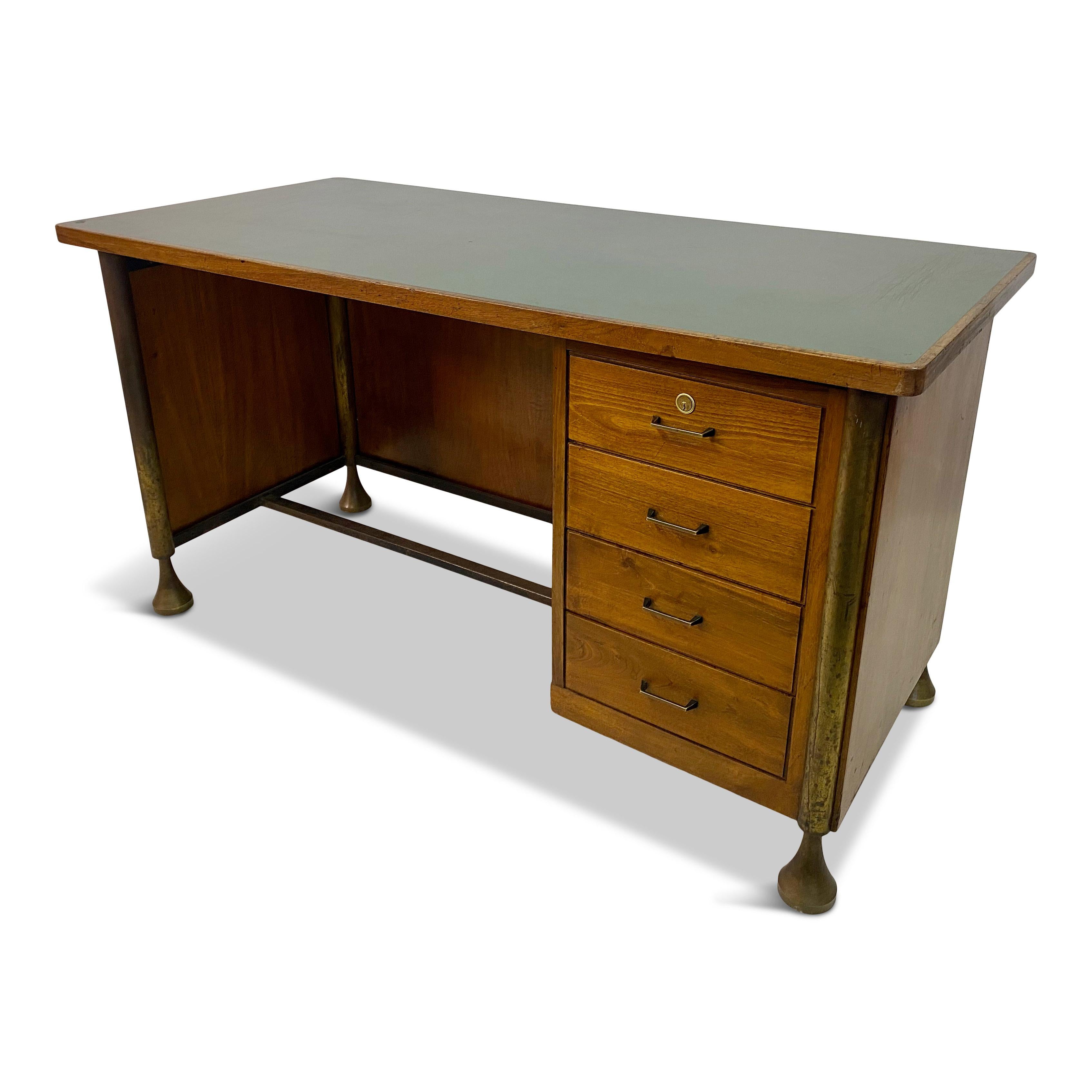 Walnut desk

Bronze legs

Formica top

Black painted brass handles

Lockable top drawer with key

Bronze legs reminiscent of ones used on tables designed by Angelo Mangiarotti

Italy 1950s.
 