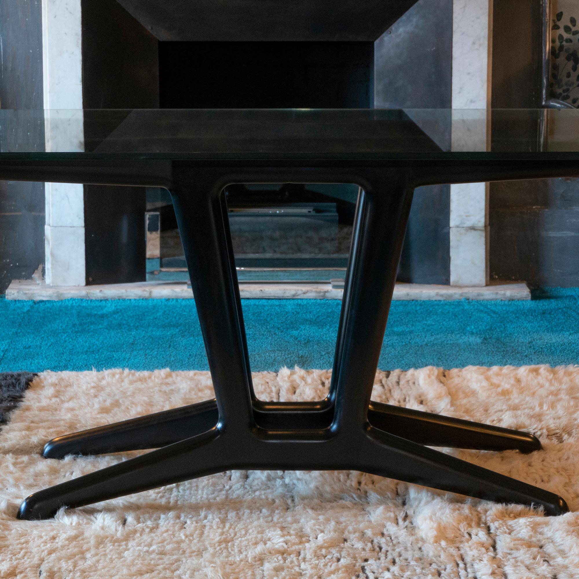 Ebonized cherry wood dining table in the style of Carlo Mollino, original glass top scratches and vintage patina. Italy 1950s.