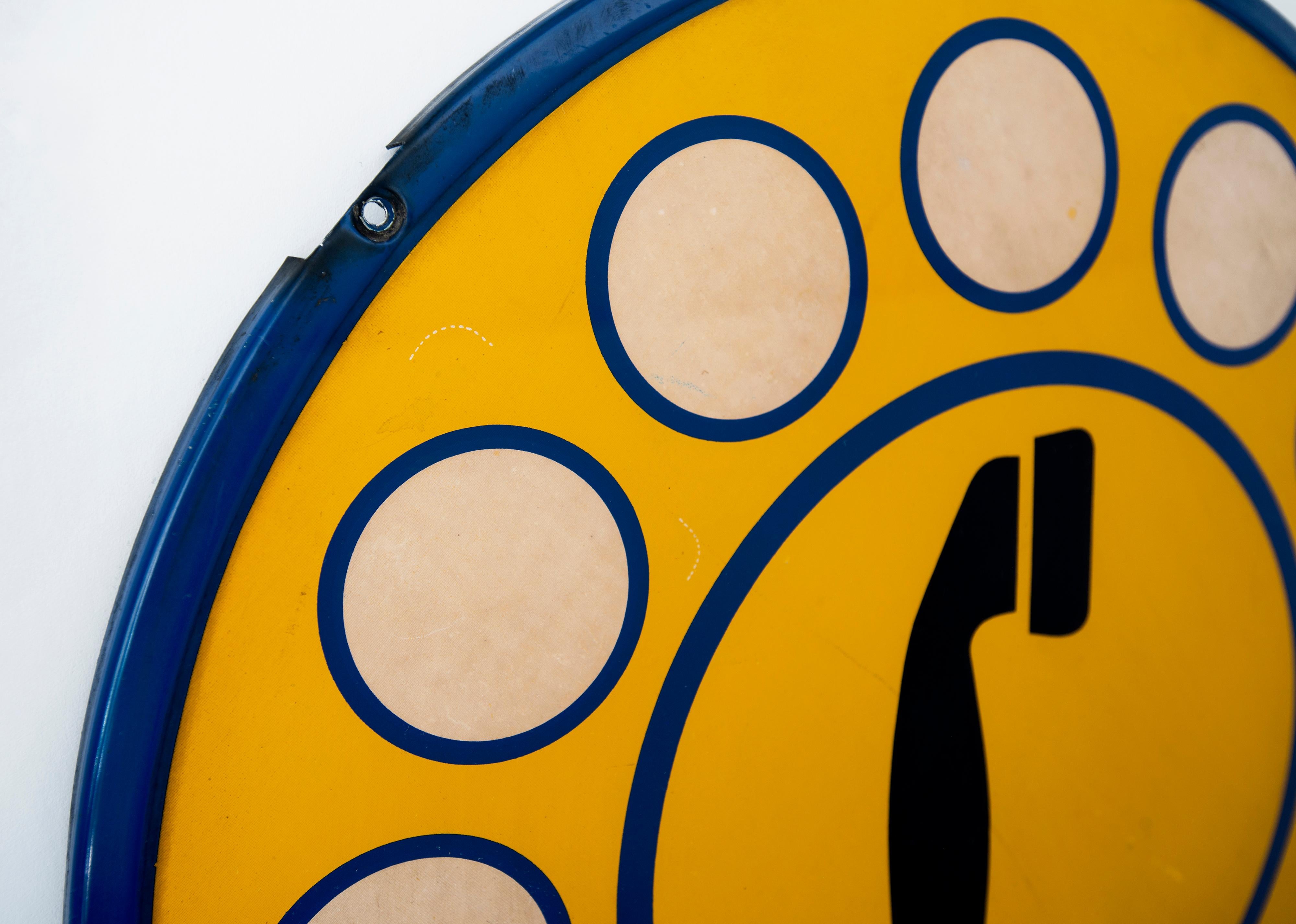 Fantastic vintage Italian telephone sign newly framed. Convex metal circle with yellow and blue painted enamel. Some light scratches and chips in paint. Eye-catching piece to put on display.
Measures: 19