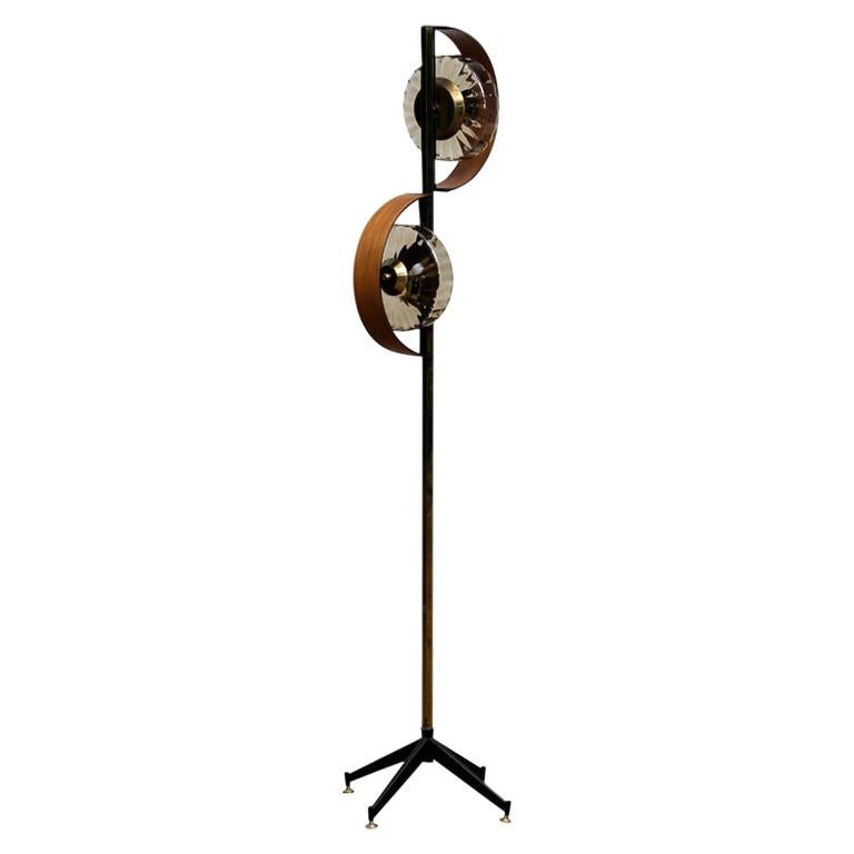 Beautiful and rare Italian floor lamp with smoked glass shades and made of brass and teak and standing on a metal stand with brass feet.
This floor lamp is technically in good condition. It consists two bulbs size: E14 / E17 and suit 110 / 230