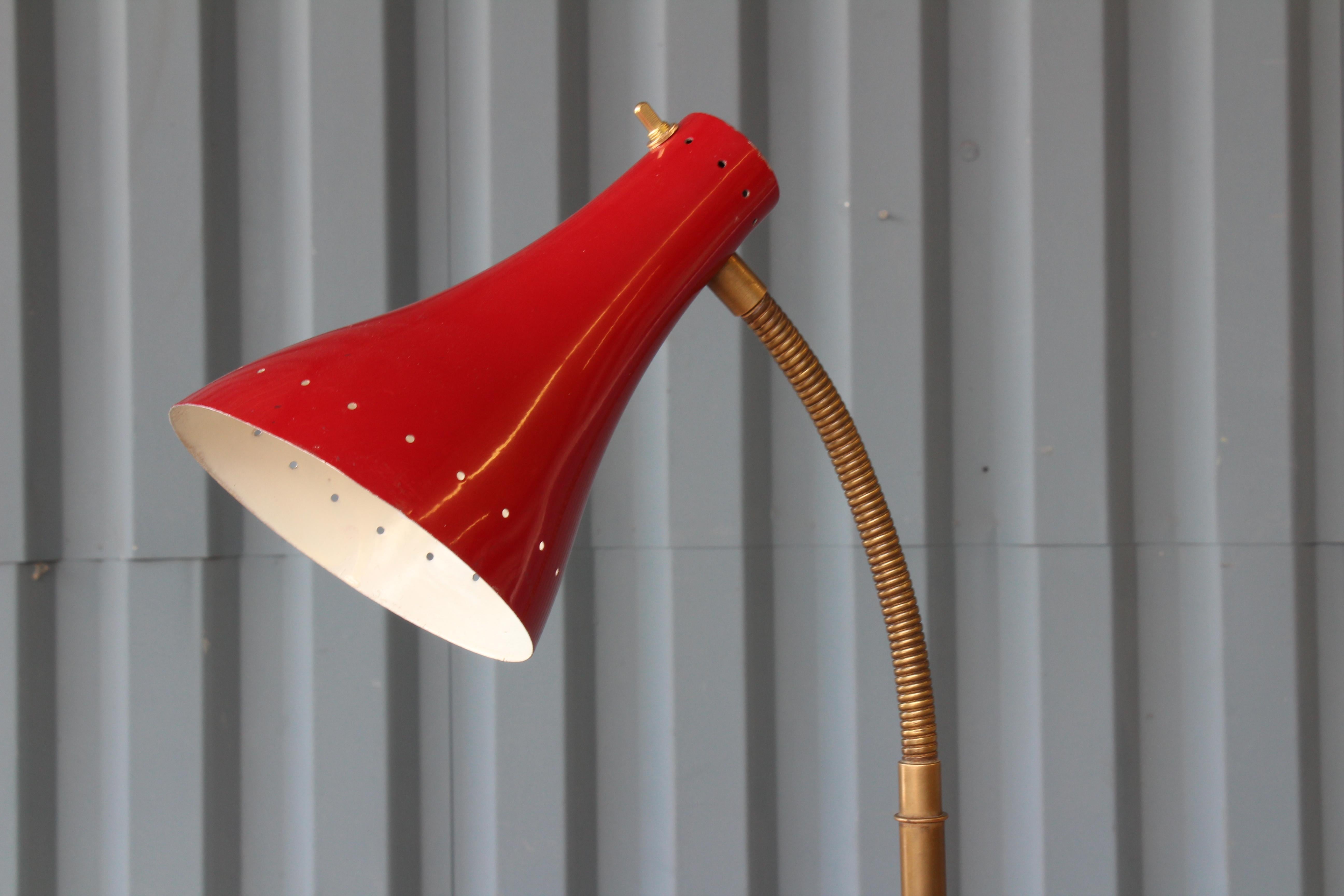 1950s Italian floor lamp with a red enameled shade and a marble base. Newly rewired. Base and shade show signs of age.