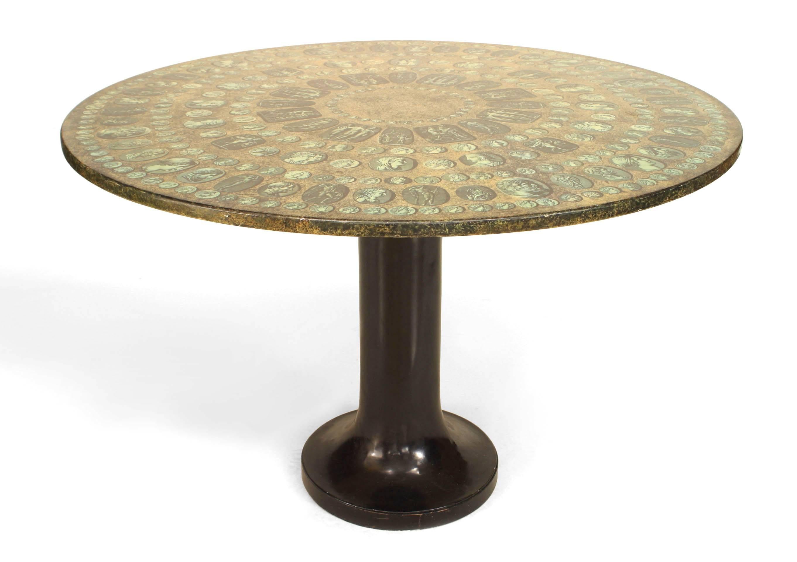 Italian 1950s center/dining table with an ebonized metal pedestal base supporting a painted & transfer decorated top with medallions of Roman Caesars. (FORNASETTI)
