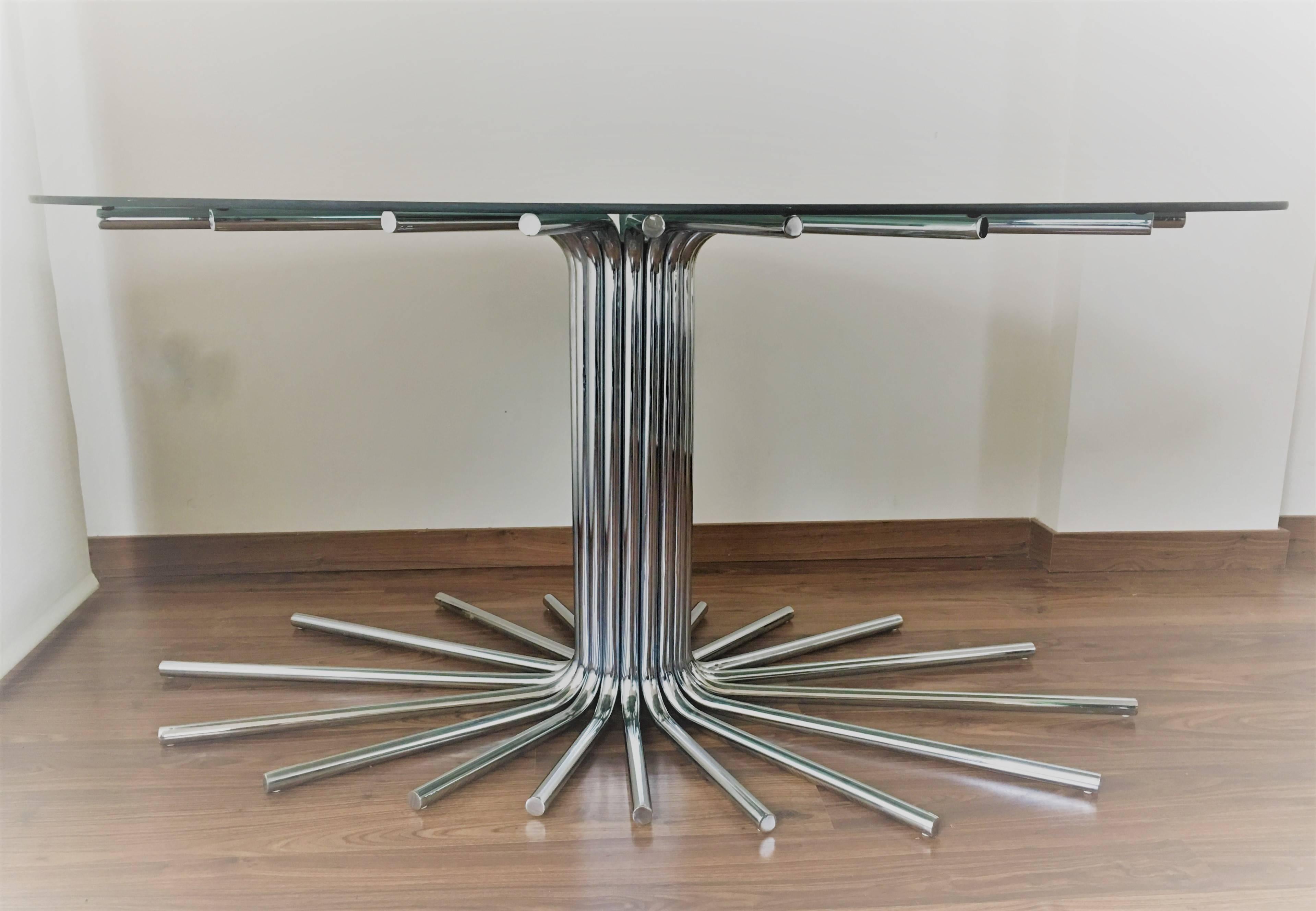 Midcentury chrome star base table with smoked glass Oval top in the manner Gastone Rinaldi. Chrome in nice condition.
Spectacular midcentury chrome starburst dining table with smoked glass top. This table allows for a guaranteed match to your