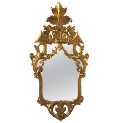 Miroir italien en bois sculpté et doré des années 1950