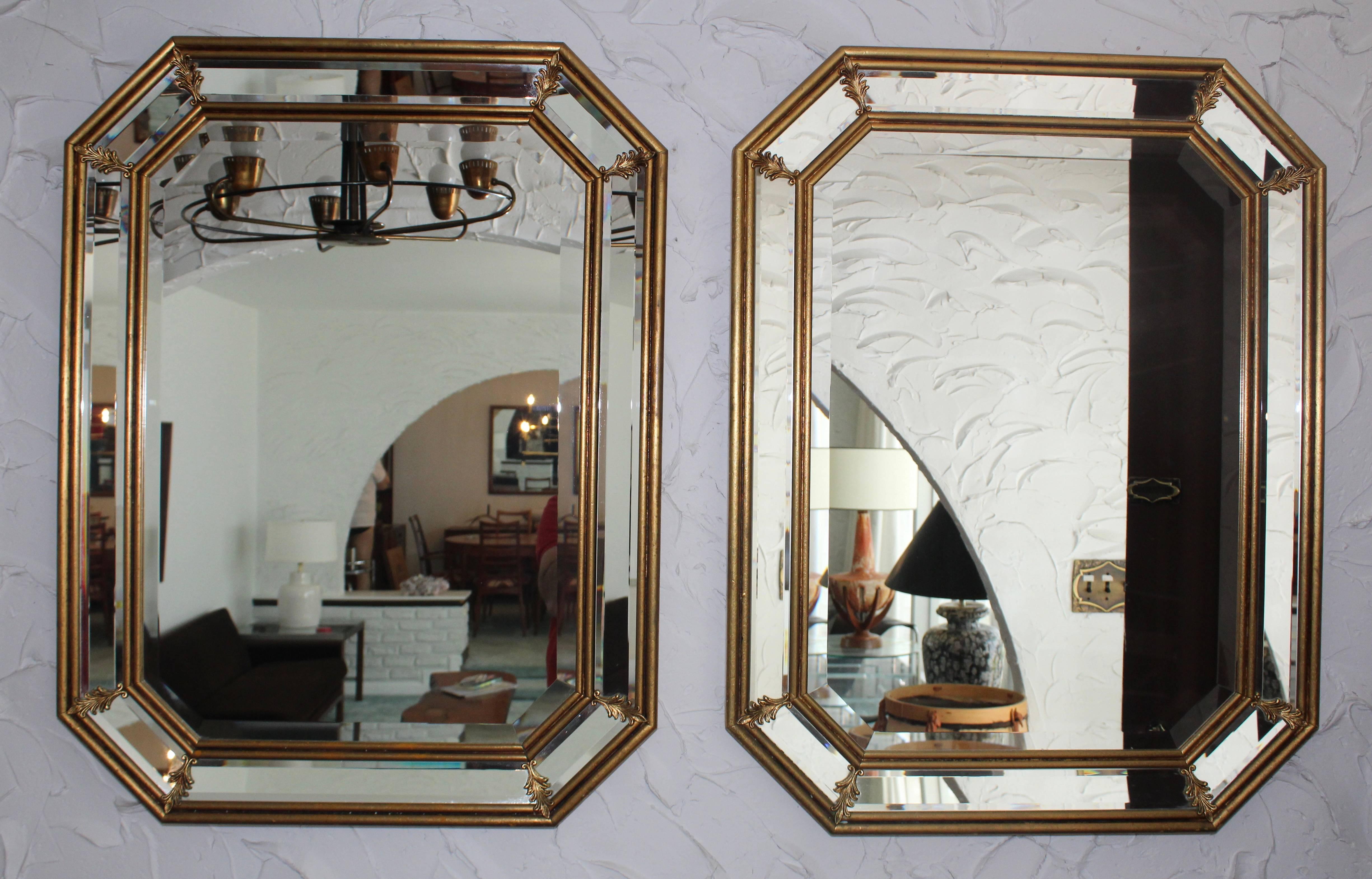 1950s Italian gilt octagonal mirrors with brass detail and beveled mirror.