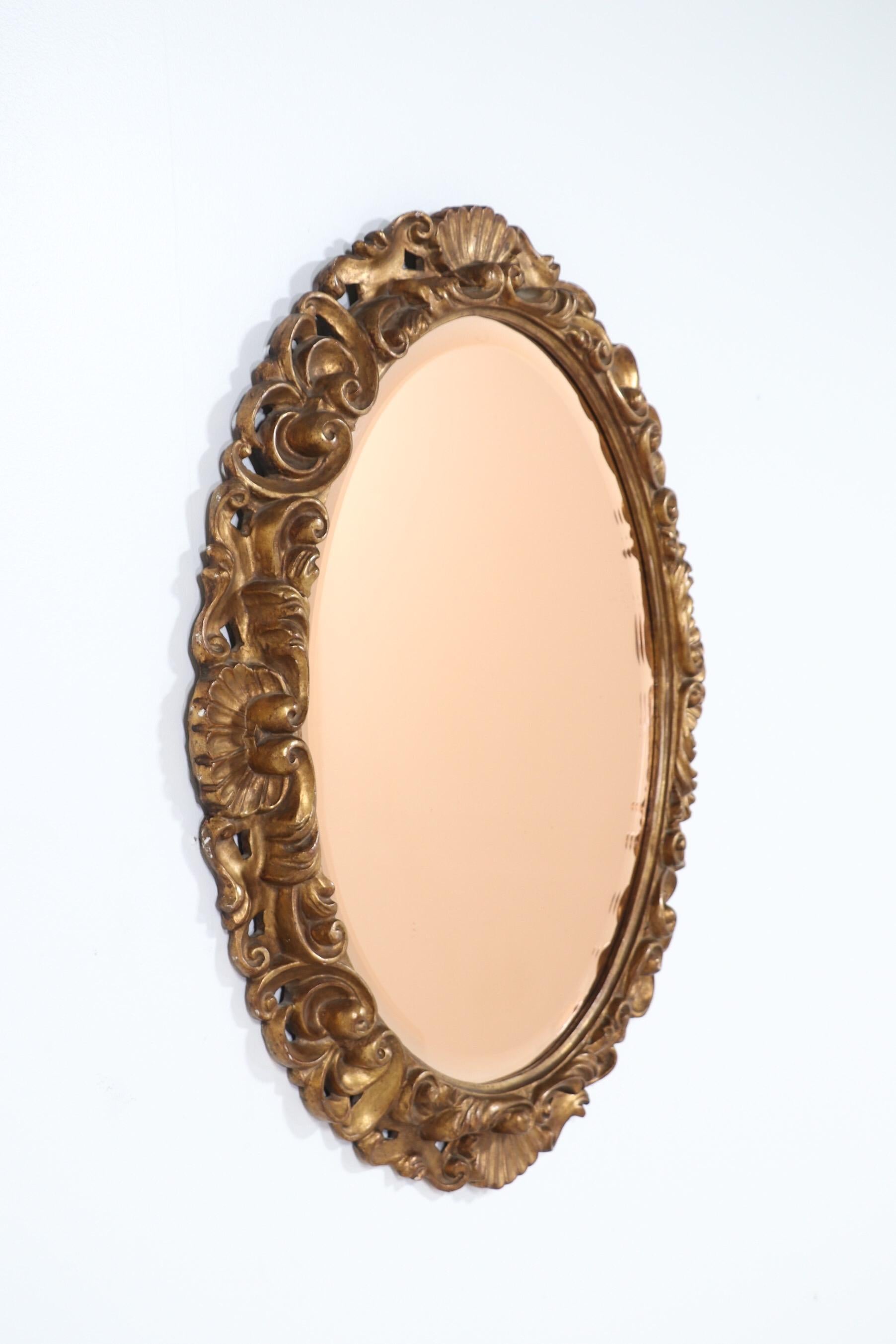 Glamorous, 1940s Italian carved giltwood frame with a rare rose-pink beveled glass mirror insert by Fratelli Paoletti, Firenze. 

Very decorative mirror, perfect for adding a touch of European flare to any interior.






 