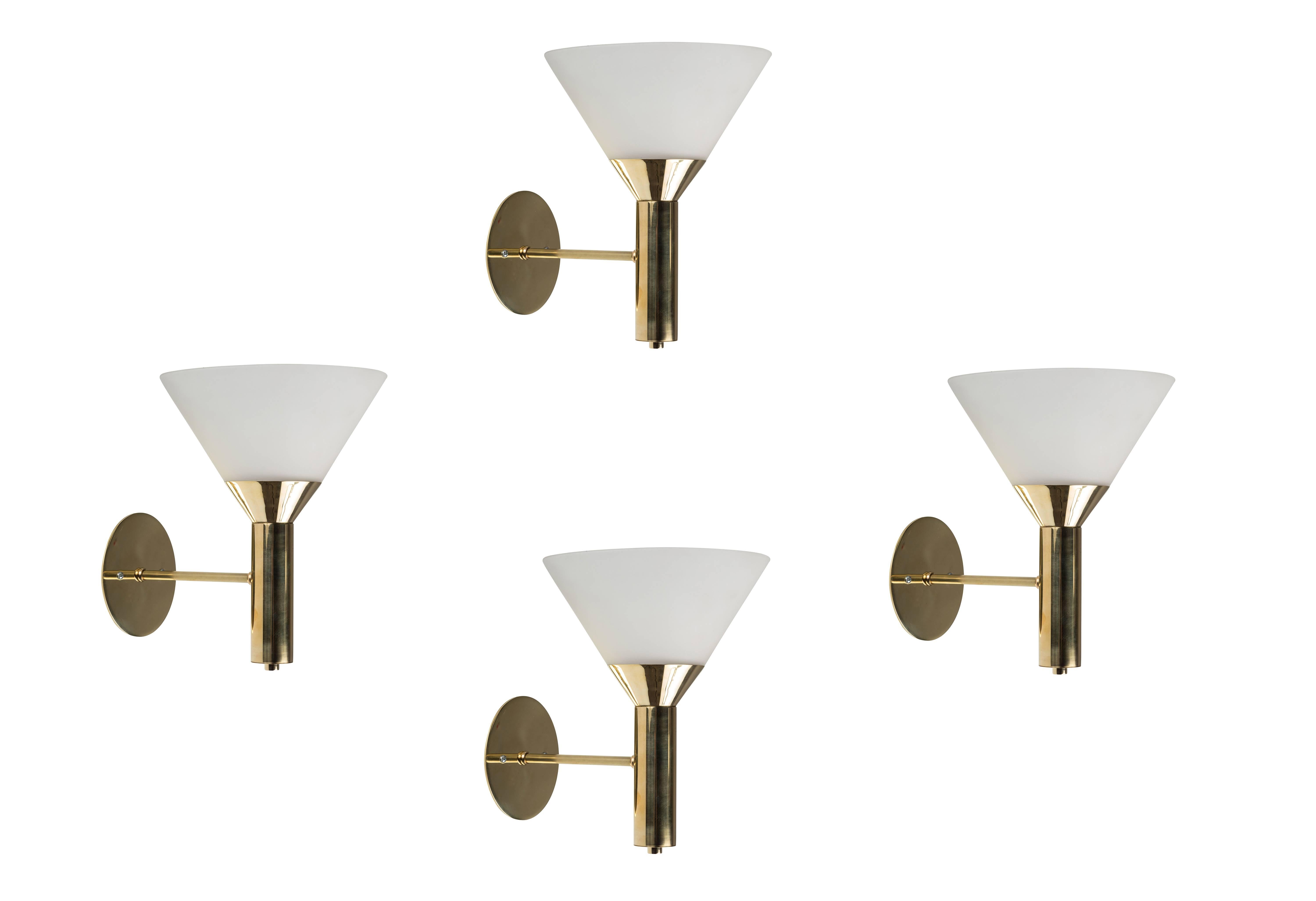 1950s Italian glass and brass cone sconces. Executed in polished brass and conical opaline glass in the manner of Stilnovo. A sculptural and refined lighting design reflecting midcentury Italian aesthetics at their highest level.

Price is per