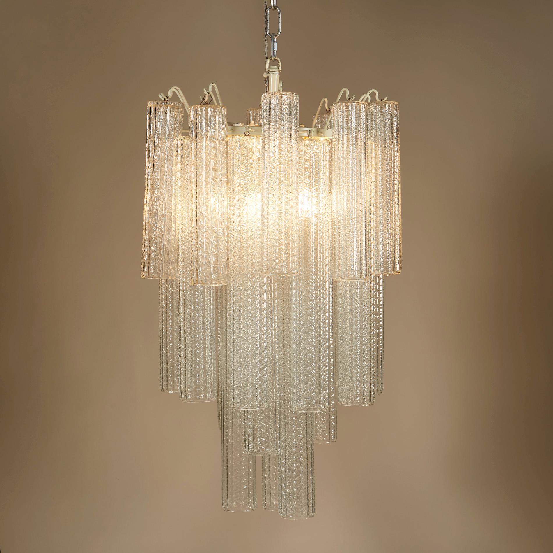Superb Murano glass chandelier in four tiers of unusually long textured cylindrical drops.

Venini Glass was founded in 1921 on the island of Murano by Paolo Venini. Over the century the manufacturers were responsible for some of the most