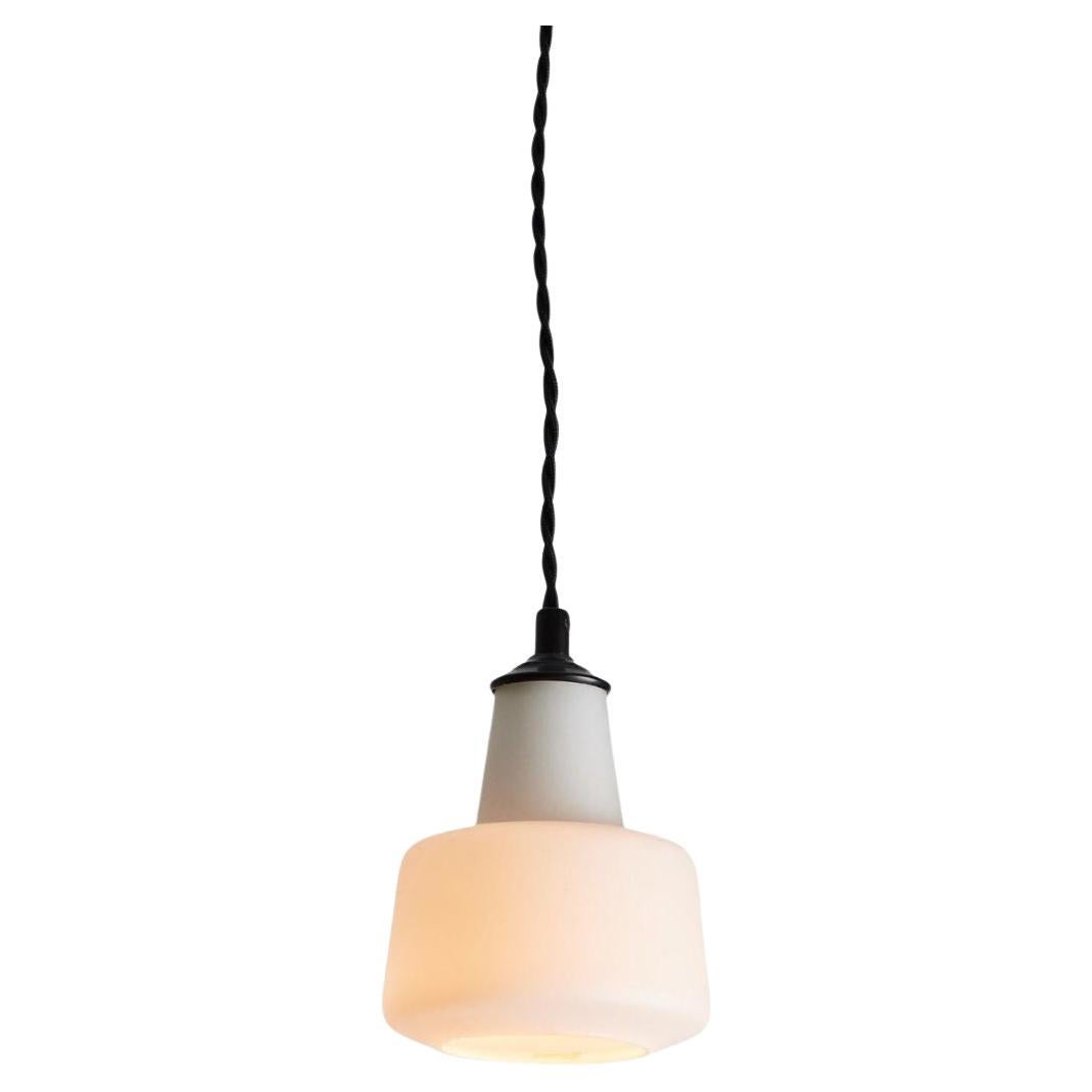 1950s Italian glass pendant attributed to Stilnovo. Executed in opaline matte glass, brass and black painted metal. This sculptural and refined pendant is characteristic of 1960s Italian glass lighting design at its highest level.

Price is per