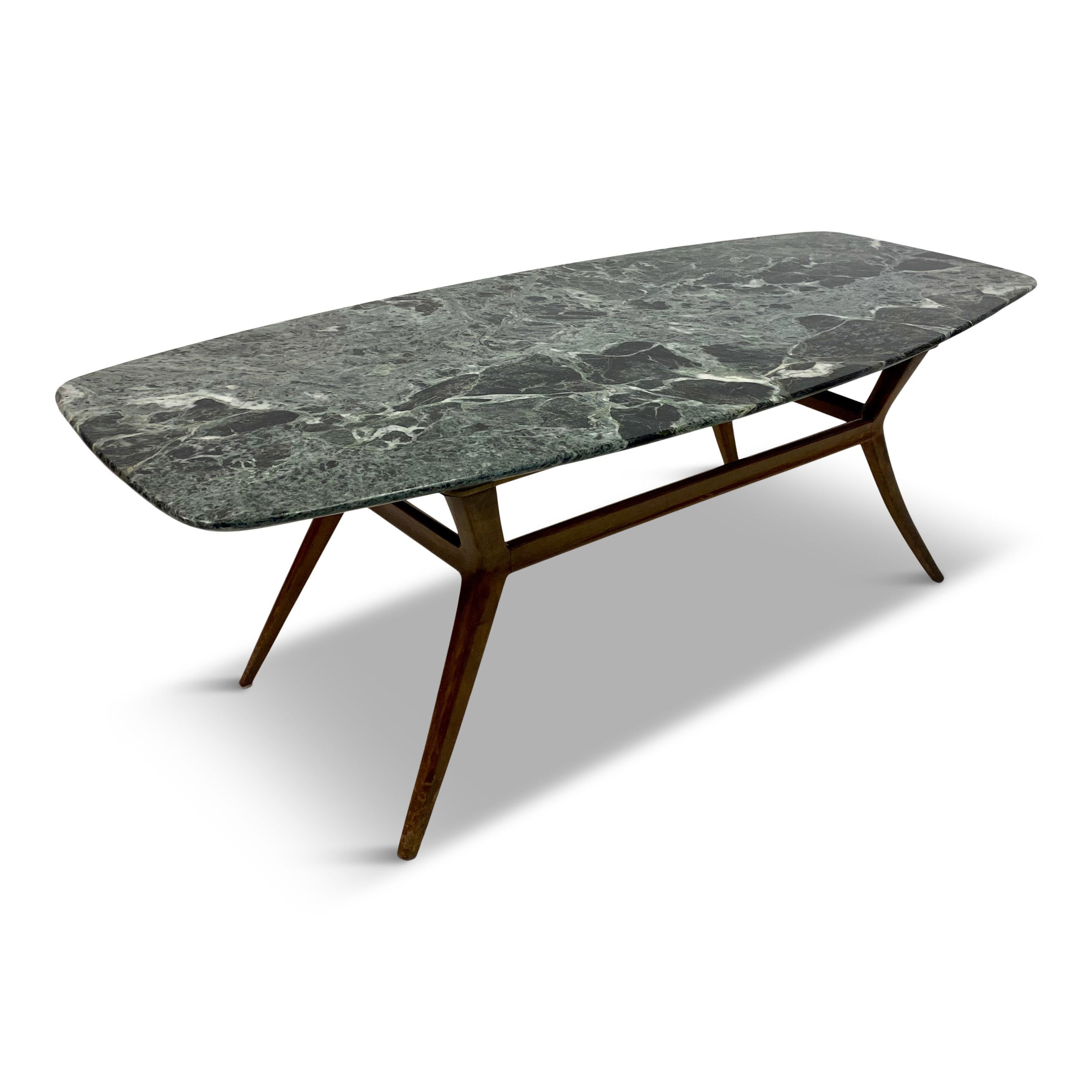 Coffee table

Striking green marble top

Elegant walnut base

Italy 1950s