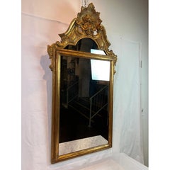 1950s Italian Hand-Carved Crested Giltwood Mirror with Starburst and Floral Bask