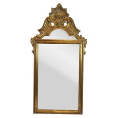 1950s Italian Hand-Carved Crested Giltwood Mirror with Starburst and Floral Bask