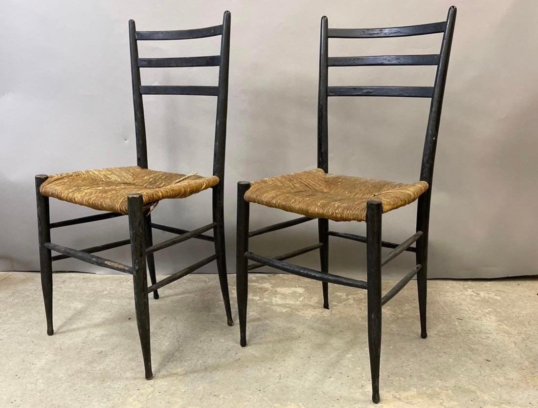 Set of 2 Spinetto chairs with a thin profile with black ebonized frames and wicker seats, manufactured in the 1950s. These chairs were the inspiration for Gio Ponti’s famous Superleggera chair. 