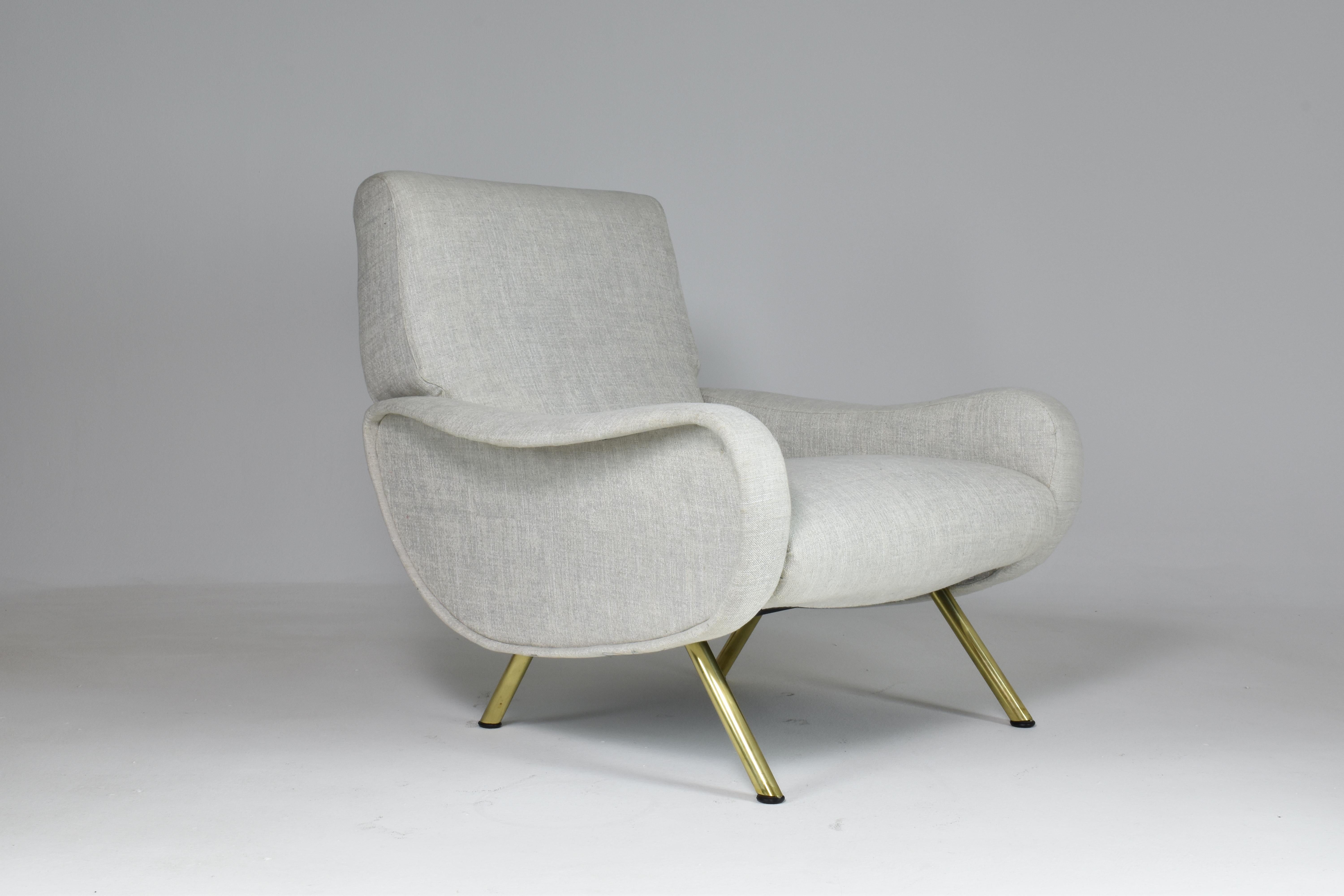 The Iconic 20th-century collectible vintage Lady chair was designed by Marco Zanuso for Arflex in Italy in 1951. The very comfortable design features splayed expertly polished brass legs and is fully restored with new foam padding in a light grey