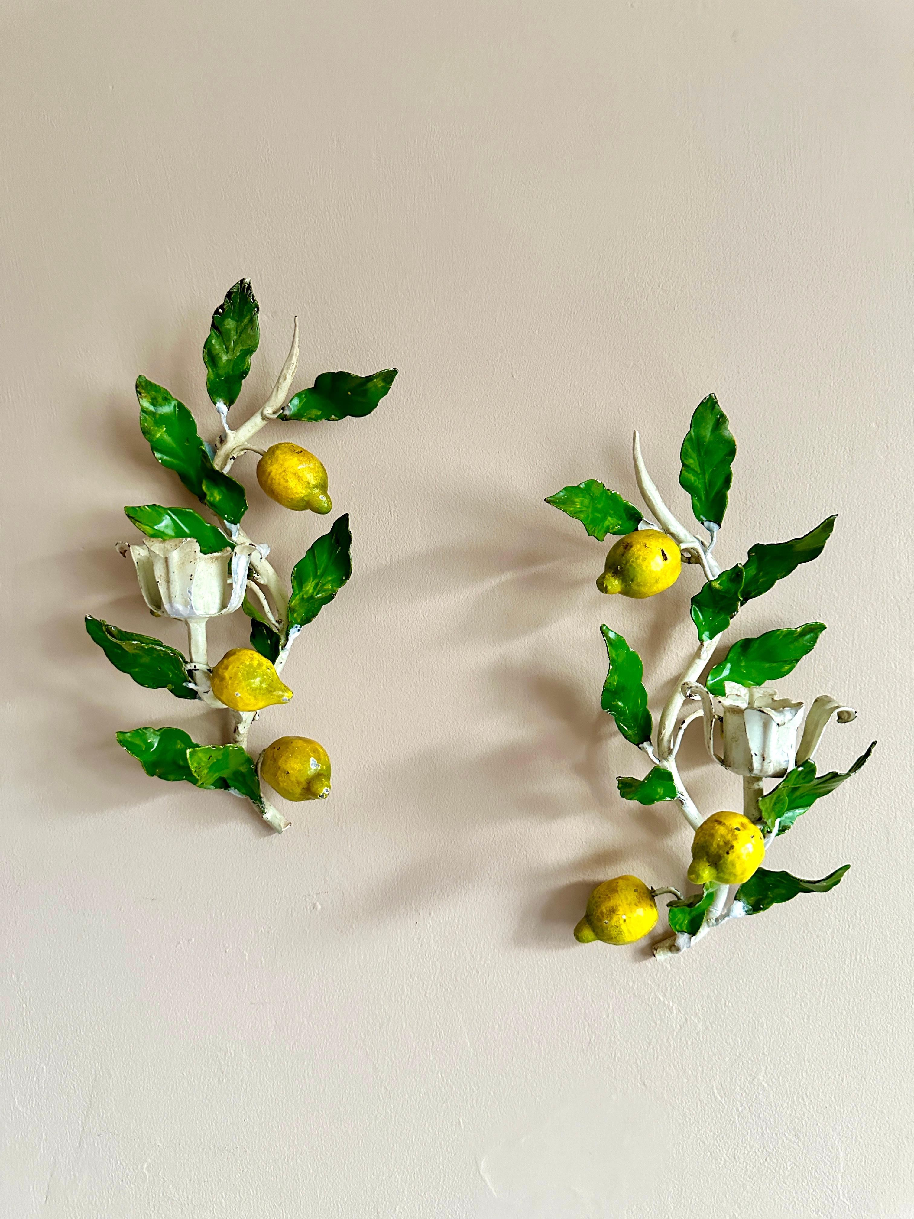 1950s Italian lemon tole candleholders. 

Superb pair of hand-painted Florentine candle sconces. In very good condition with attractive and desirable wear. 

Height 27cm Width 13cm Depth 12cm
