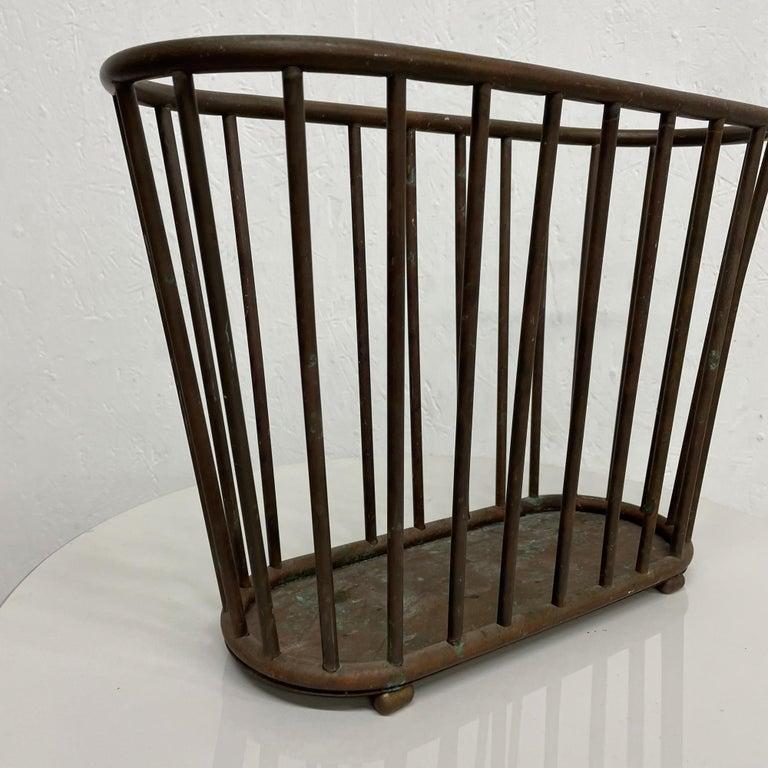 Magazine Holder
From ITALY Patinated Brass Magazine Rack Holder 1950s
Unmarked. In the Style of Gio Ponti.
Measures: 12H x 17 W x 7 D inches
Unrestored Vintage Patina Condition and Presentation. 
Shows excessive patination.
Please see our