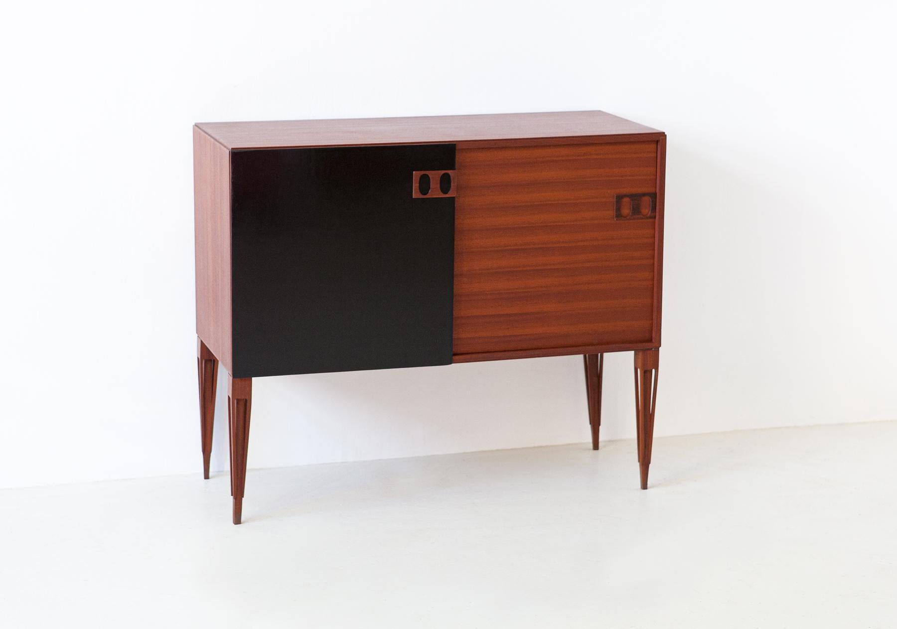 Italian modern credenza manufactured in Italy by Fratelli Proserpio during the 1950s.

This mahogany cabinet has two sliding doors one of the two hand lacquered with black shellac.

Fully restored.

The ''PPP'' company brand  present on the legs.