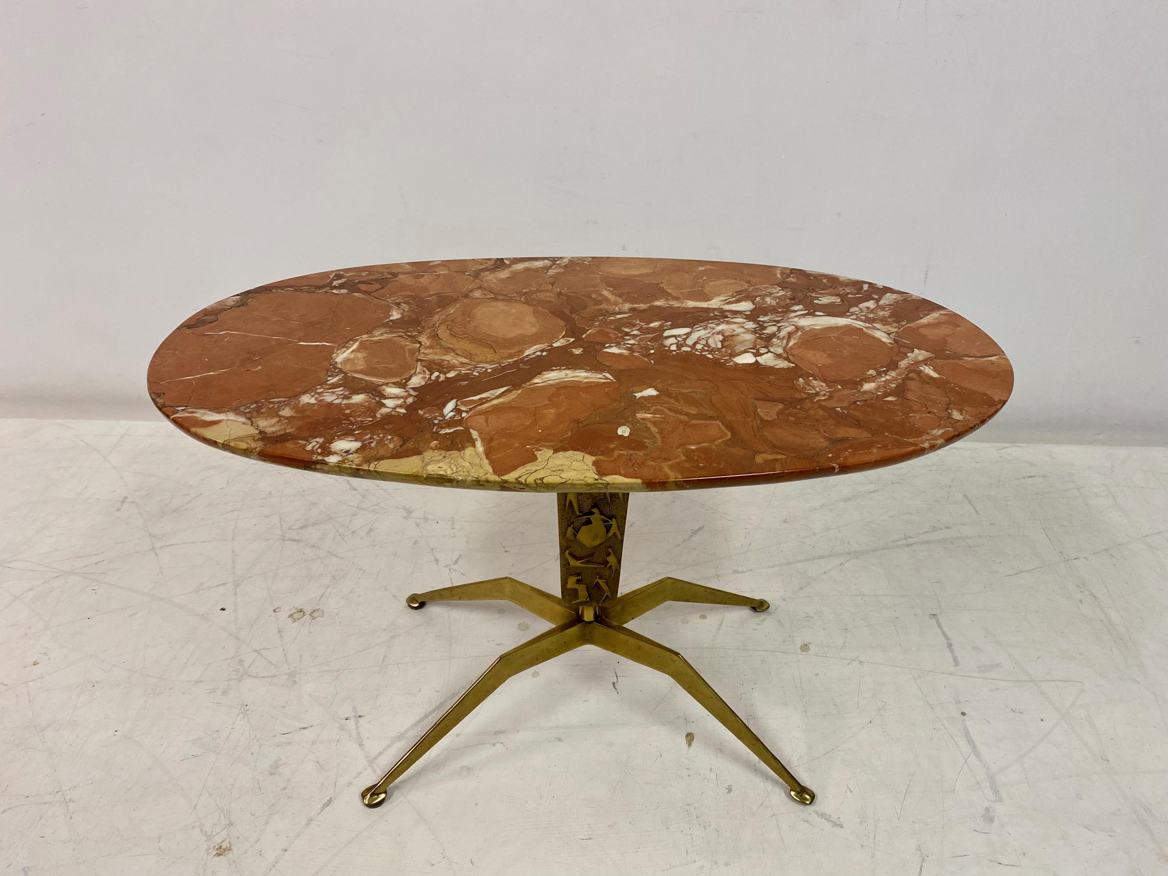 Coffee table

Marble top

Brass base

Italy 1950s.
   