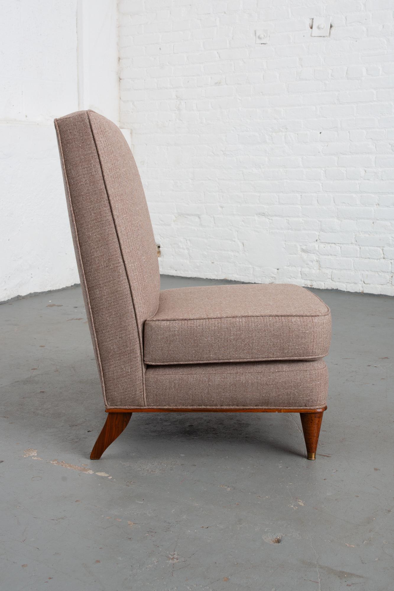 1950s Italian Mid-Century Modern slipper chair with brass sabots to the front and a handsome veneer to the rear legs. Newly upholstered with wool herringbone fabric and single welting. Seat is attached. Good original condition with markings to legs.
