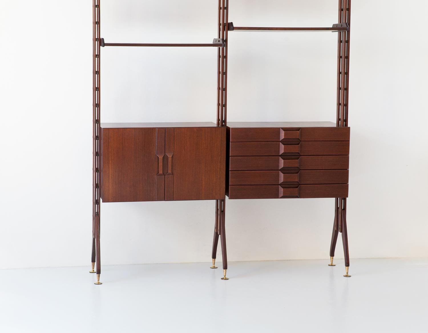 This rare Italian bookshelf came from 1950s, its modern design is full of technical details and workmanship typical of high-level Italian manufacturing of the midcentury. The special brass parts have been specially made for this modular