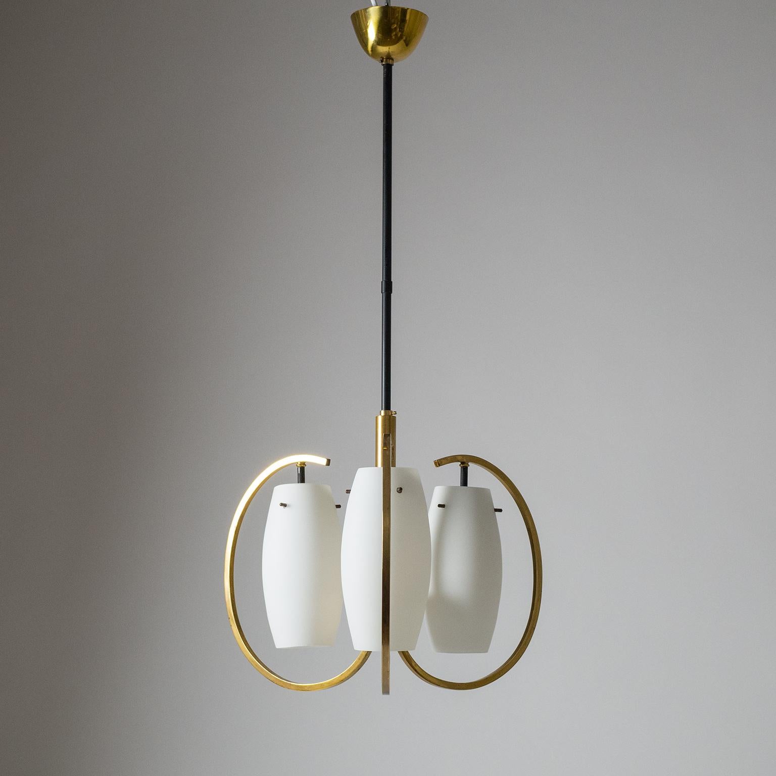 Modernist 1950s Italian three-arm chandelier in Classic midcentury color scheme of brass, black and white. Since the stem is composed of two parts this can be easily configured for low ceilings with a chandelier height of approximate 17 inches/44
