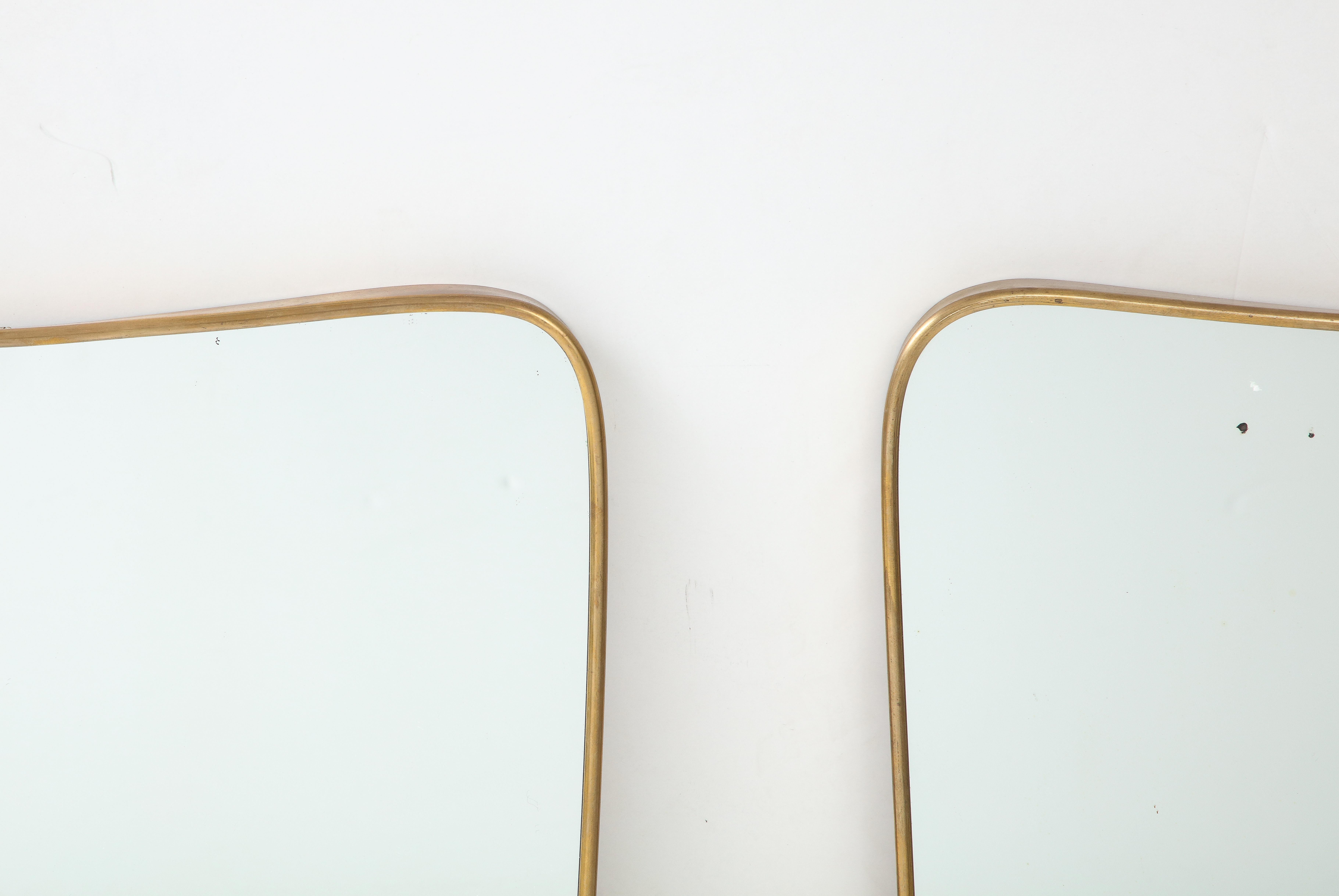 1950s Italian Modernist Pair of Shaped Brass Mirrors In Good Condition For Sale In New York, NY