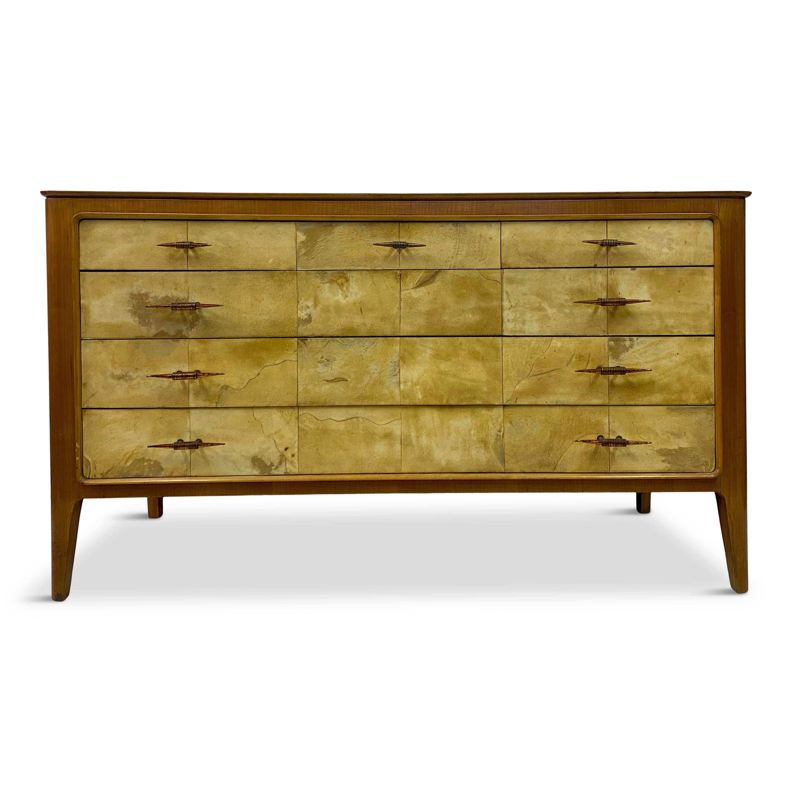 Chest of drawers.

Cherry wood frame.

Parchment fronts.

Brass handles.

Italy 1950s.