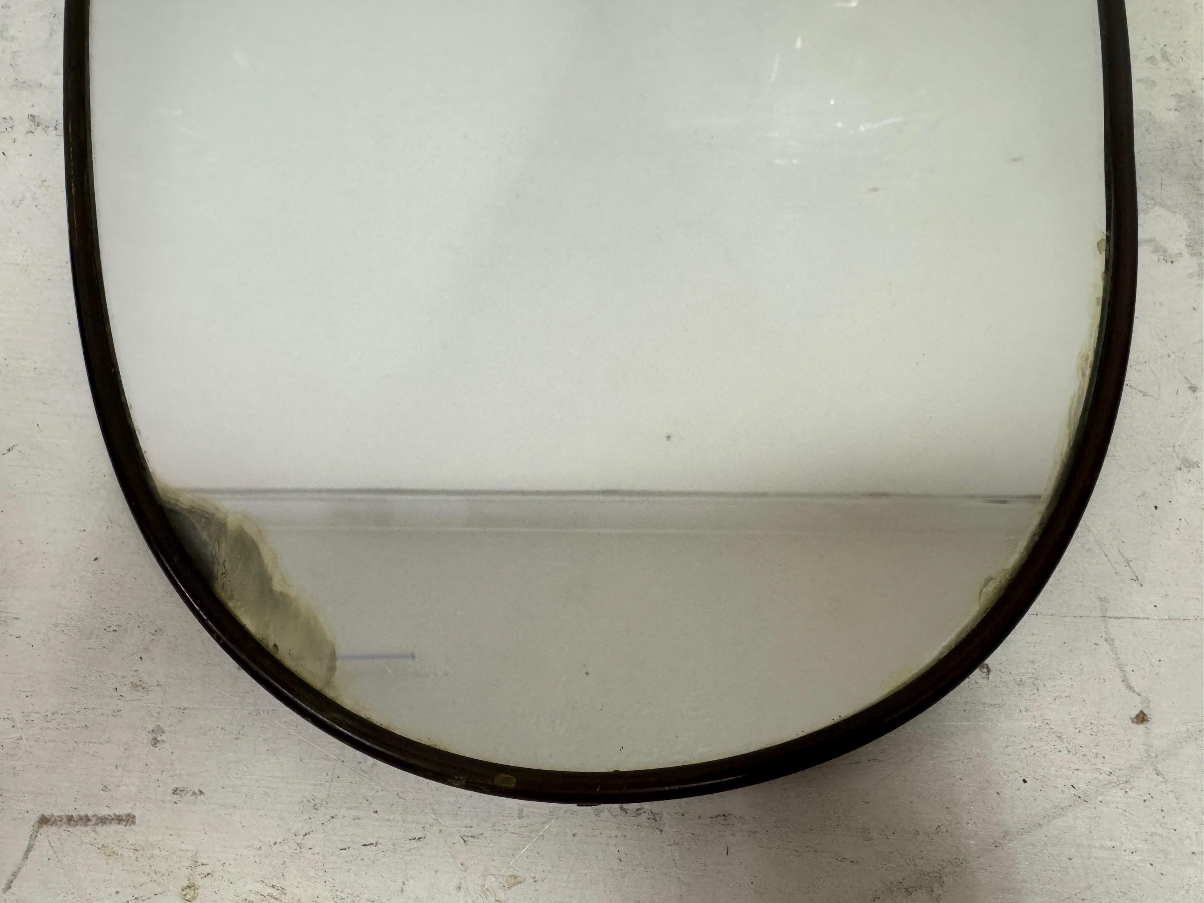Mid-Century Modern 1950s Italian Patinated Brass Mirror with Scroll Detailing For Sale