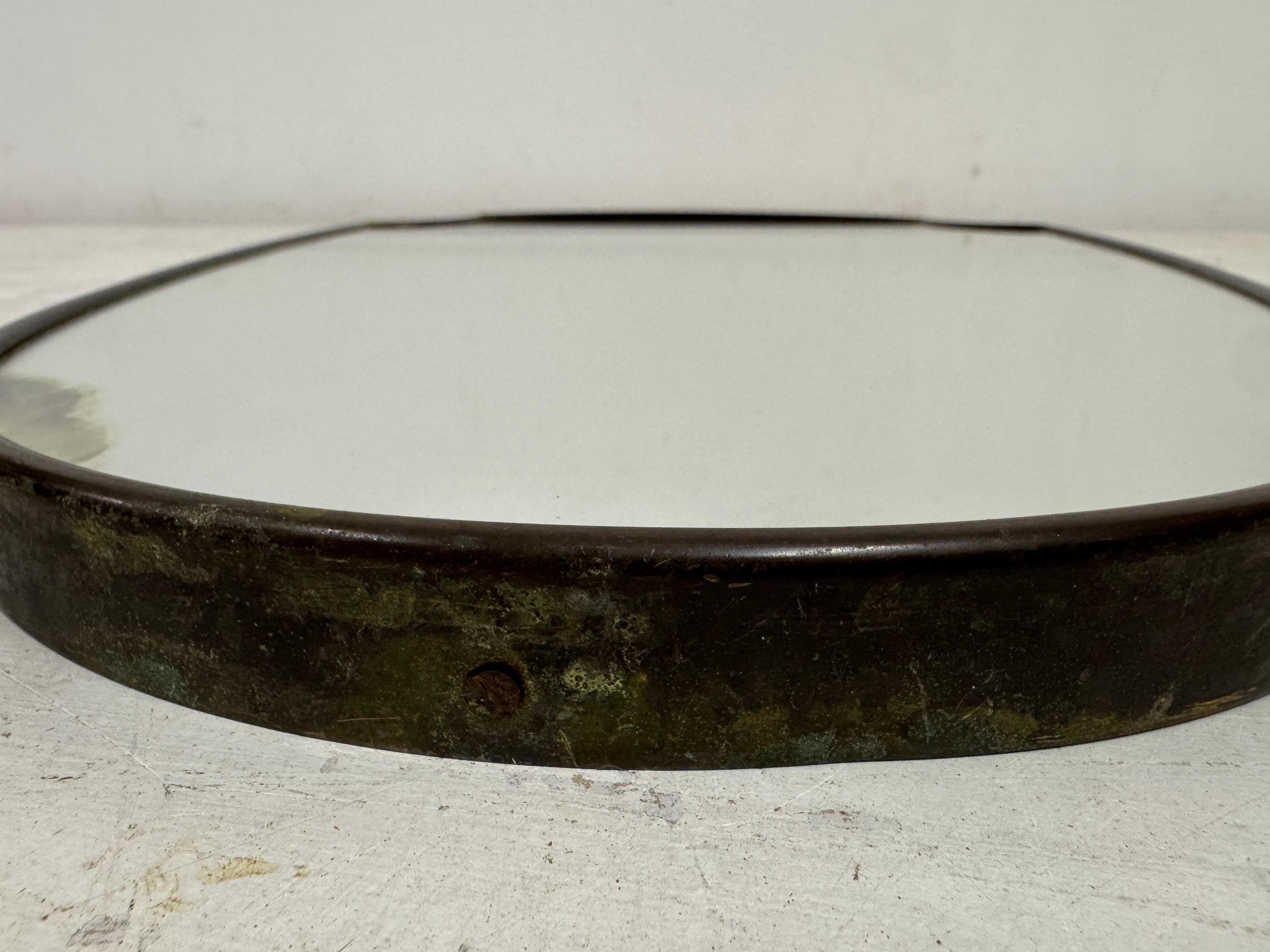 1950s Italian Patinated Brass Mirror with Scroll Detailing In Fair Condition For Sale In London, London