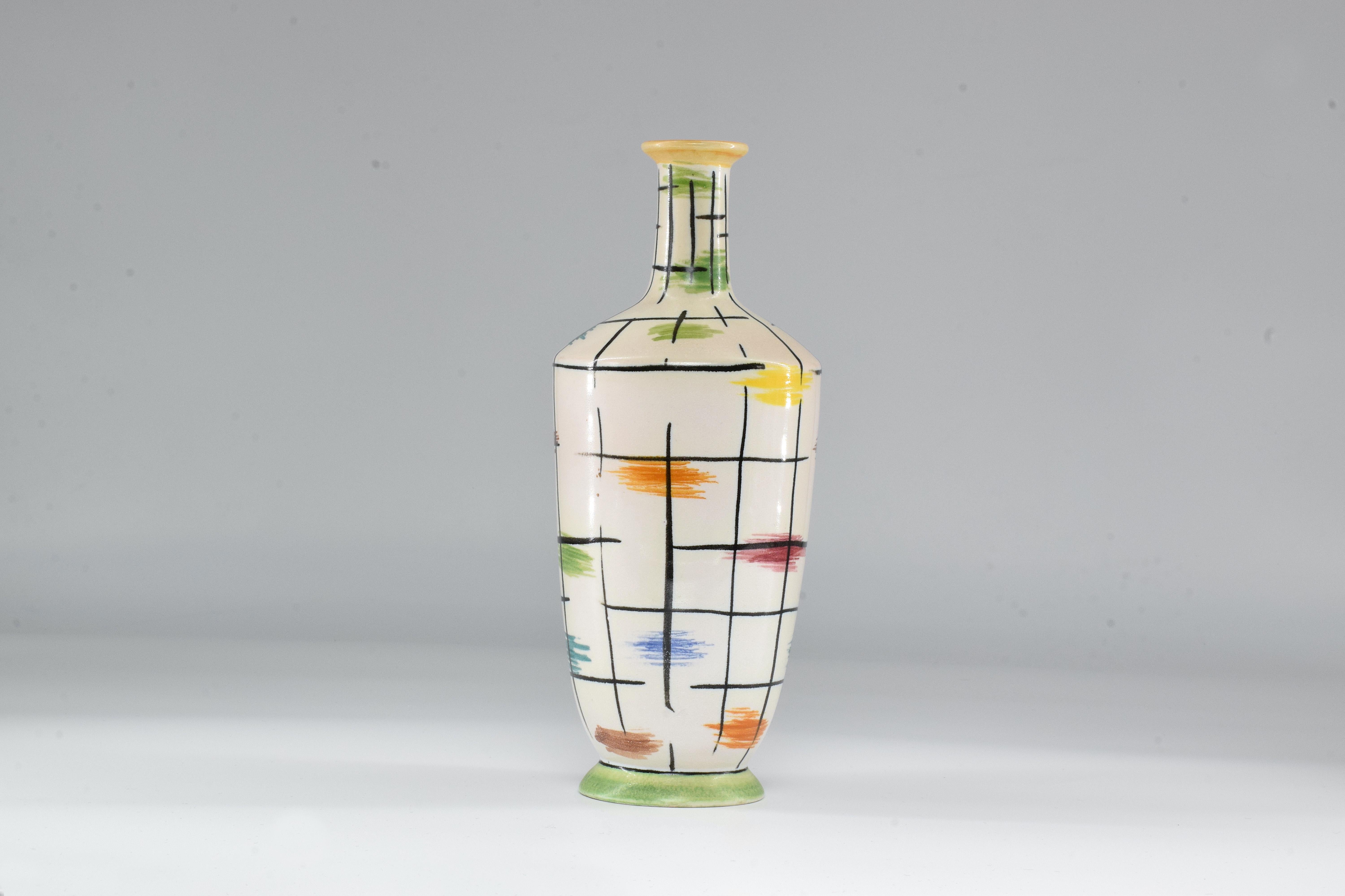This decorative ceramic vase is an original art piece by Italian designer Pucci Umbertide, known for mixing colors in a midcentury spirit with hand painted patterns. A great fit to lighten up any living area.

We are an exhibition space and an