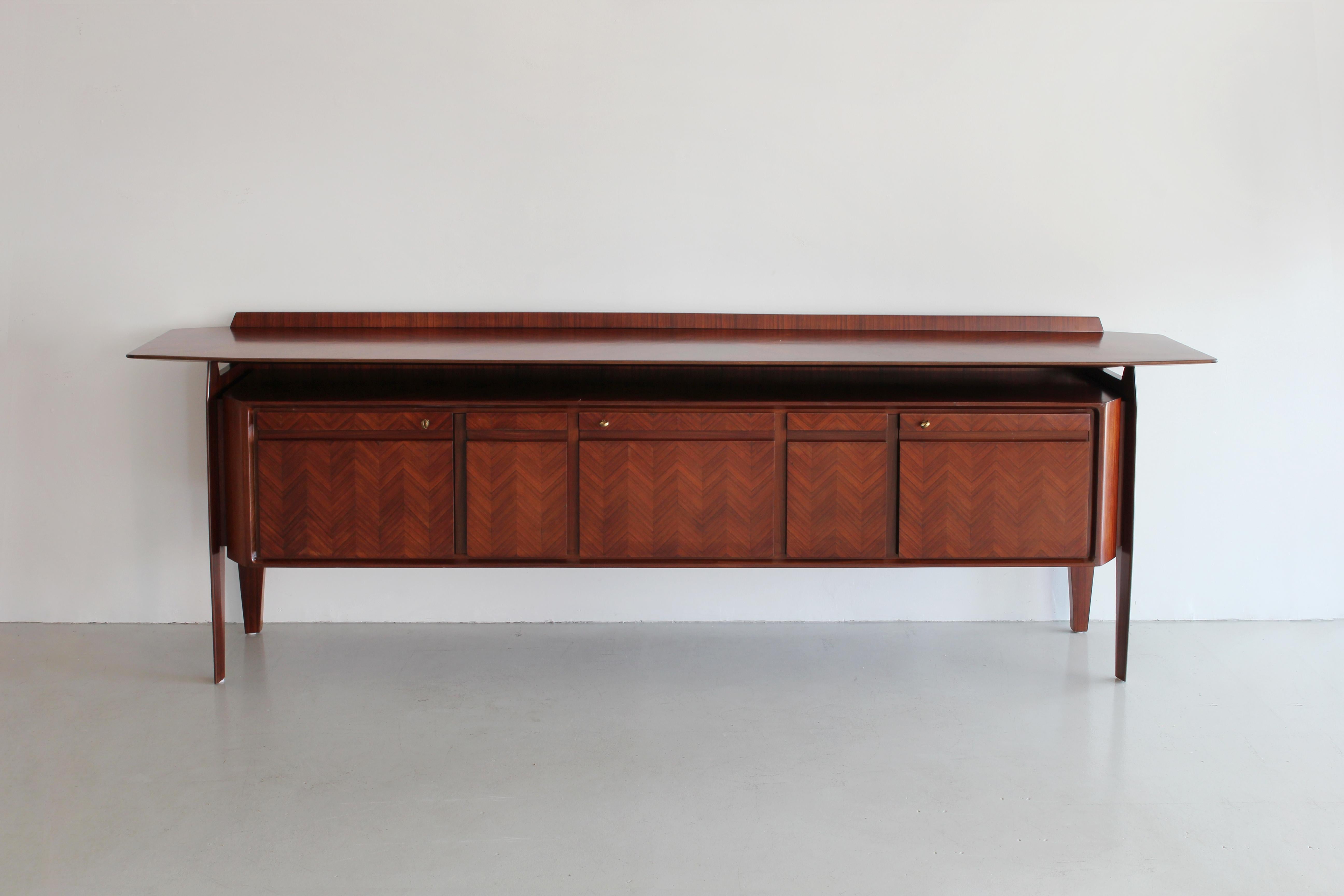 Gorgeous Italian sideboard by Cantu Furniture Artisans. 

Chevron patterned rosewood front, floating top and cabinet doors that reveal ample storage with drawers.