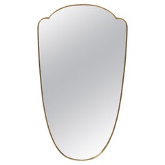 1950s Italian Shield Shaped Brass Mirror 1950s Italian Shield Shaped Brass Mirror