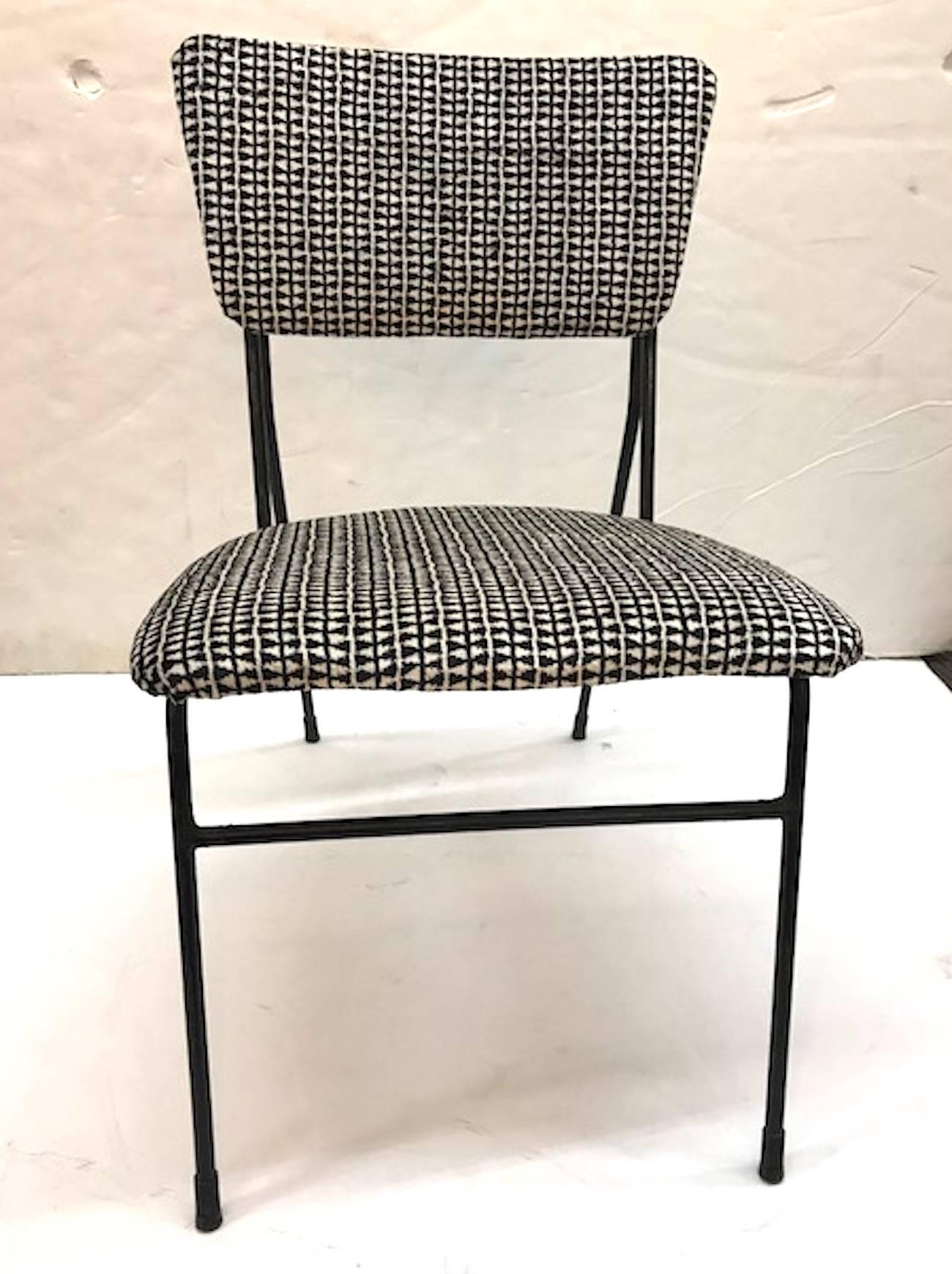 Italian 1950s modern arm side chair newly upholstered in black and white Italian velvet fabric. Original black finish on iron with light wear and distressing. Chair measures: 17.5