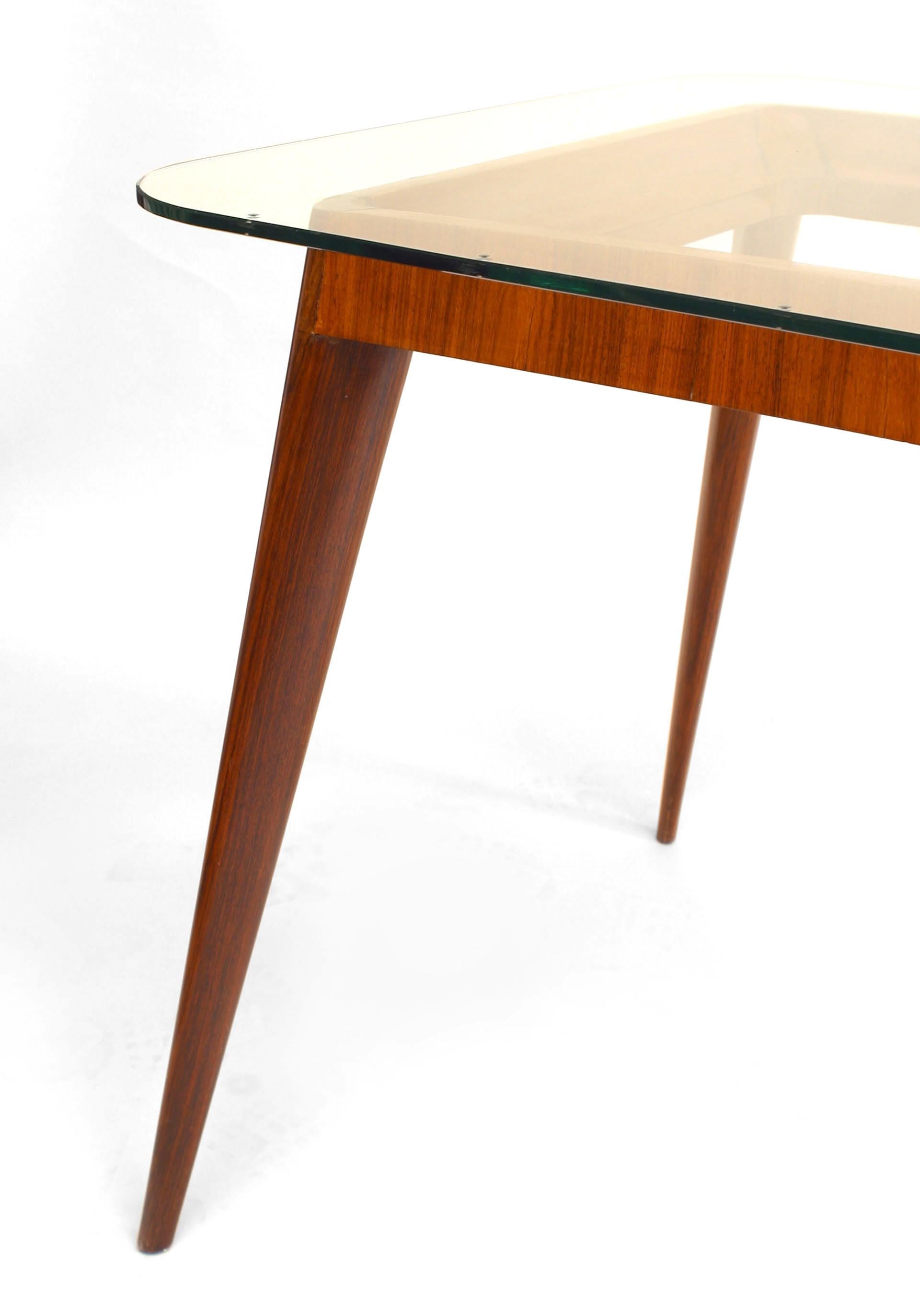 Italian Mid-Century (1950s) rosewood dining table with 4 tapers legs supporting a large glass top (Related Item: DLB181A)
