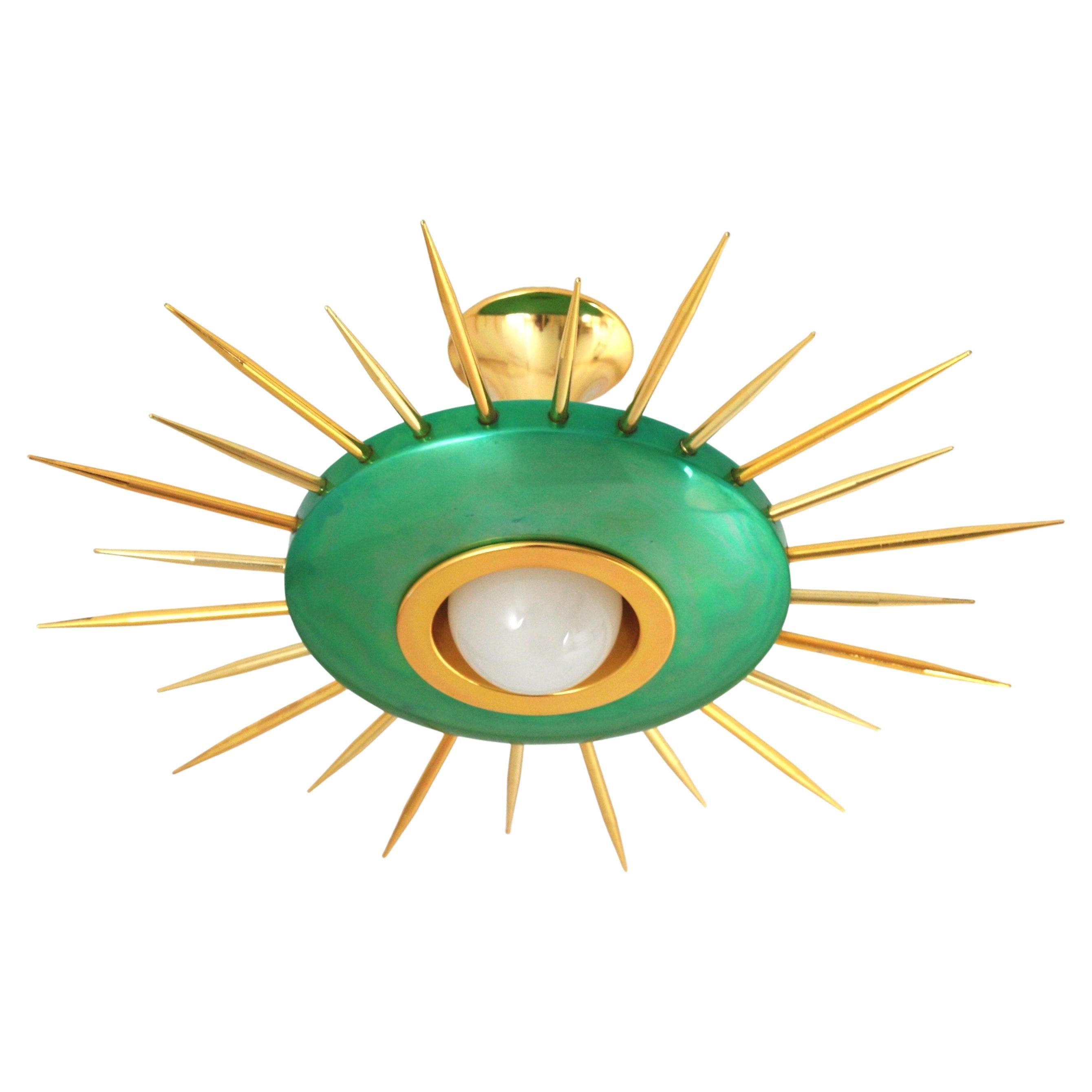 Mid-Century Modern green metal and golden sunburst suspension light ot flush mount. Italy, 1950s.
This eye-catching ceiling lamp features a green metal shade surrounded by gilt metal thick rays in two sizes. It has a central light and it is topped