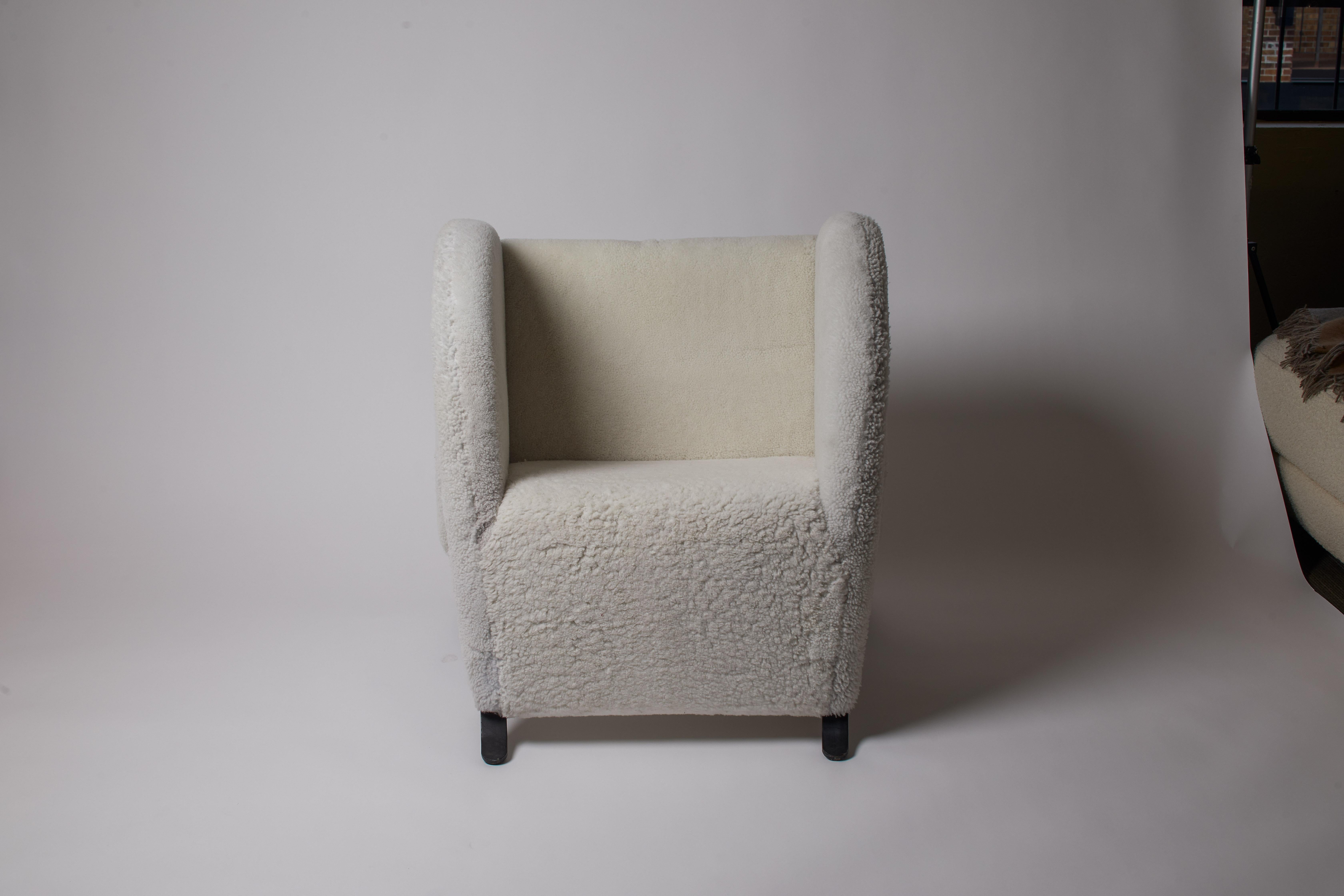 1950s Italian unique curved design architectural armchair with curly white shearling. Restored and reupholstered.