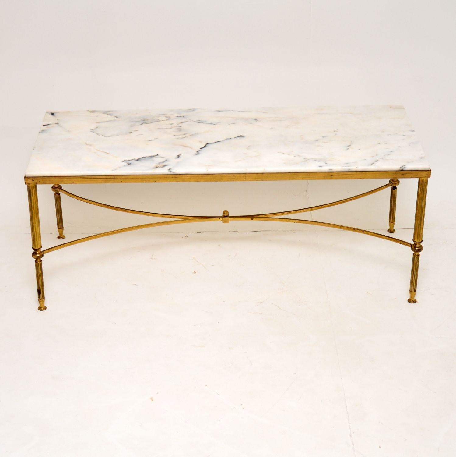 A stunning vintage coffee table in brass and marble, this was made in Italy. It dates from the 1950s-1960s, and is in excellent original condition. The frame is clean, sturdy and sound, with some minor tarnishing here and there, commensurate for