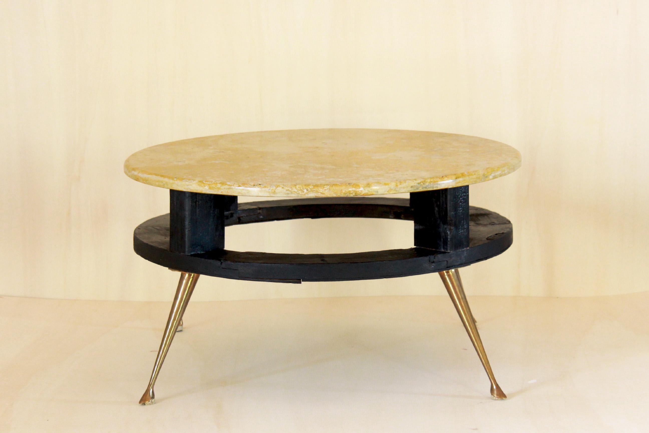 A 1950s Italian coffee table. Item made by a top in yellow travertine marble, a wood structure and brass legs. Full refurbishment made. The brass legs are the original ones. In excellent conditions.

 