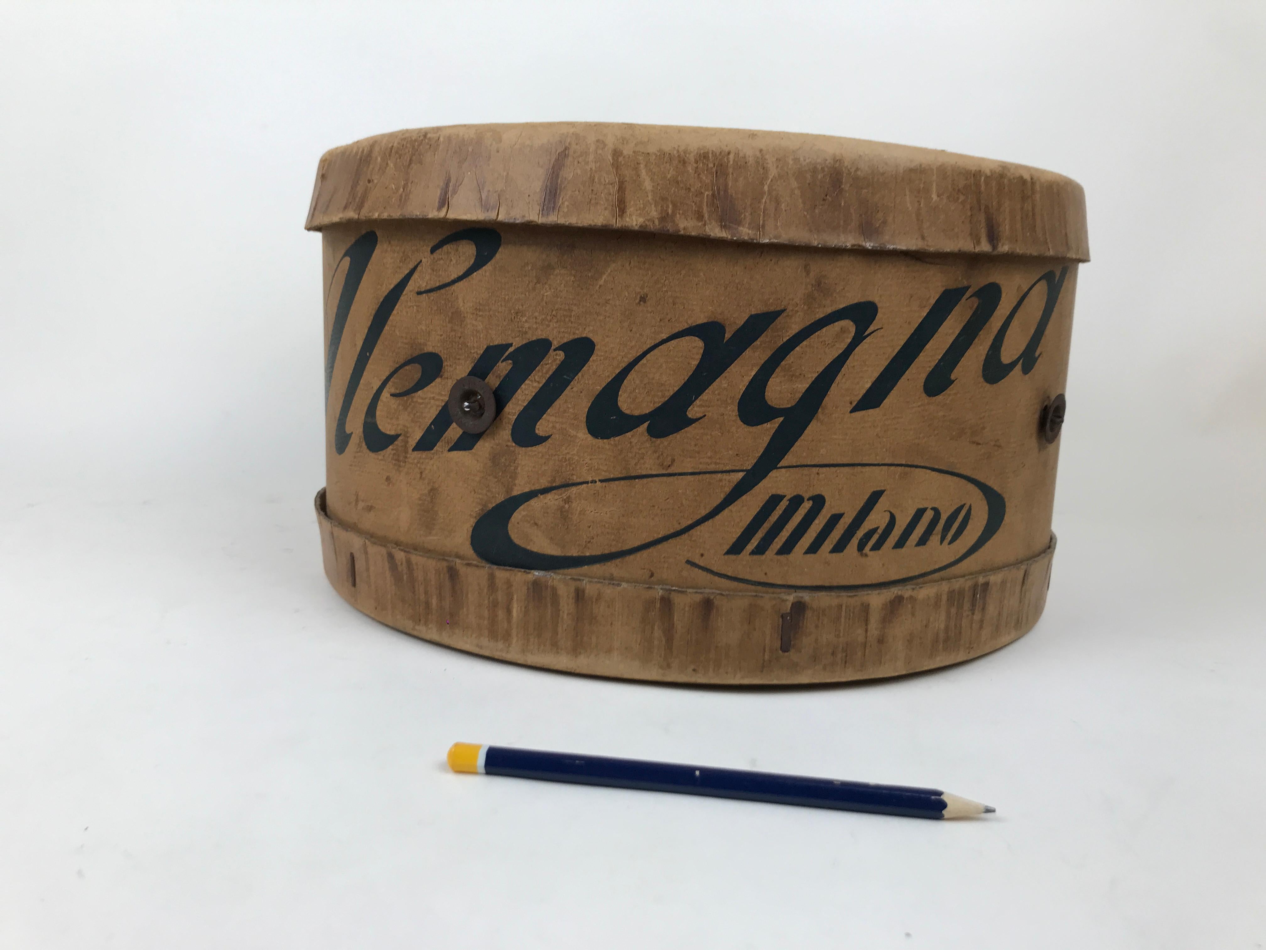 Italian vintage original cardboard box made in the 1950s by Italian famous cake company Alemagna.

The box - in the shape of hatbox - is missing its original string but is rich in patina with few lines of vernacular poetry and the original label