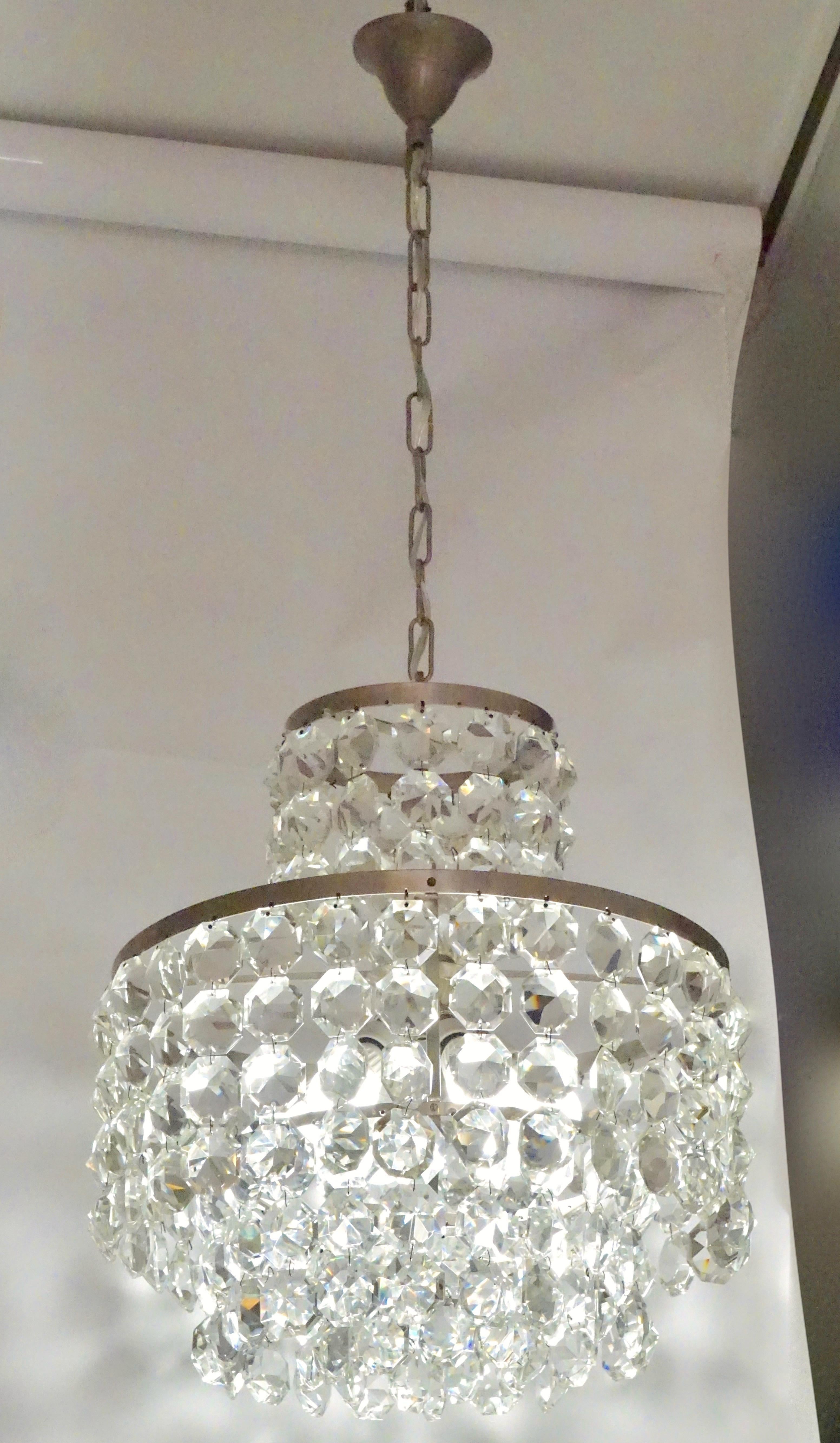 Antique four-tier cascading Murano glass curtain chandelier, entirely handcrafted in Italy. Each cut crystal drop is faceted to enhance reflections of light, the handmade steel structure in original condition has an attractive modern satin chrome