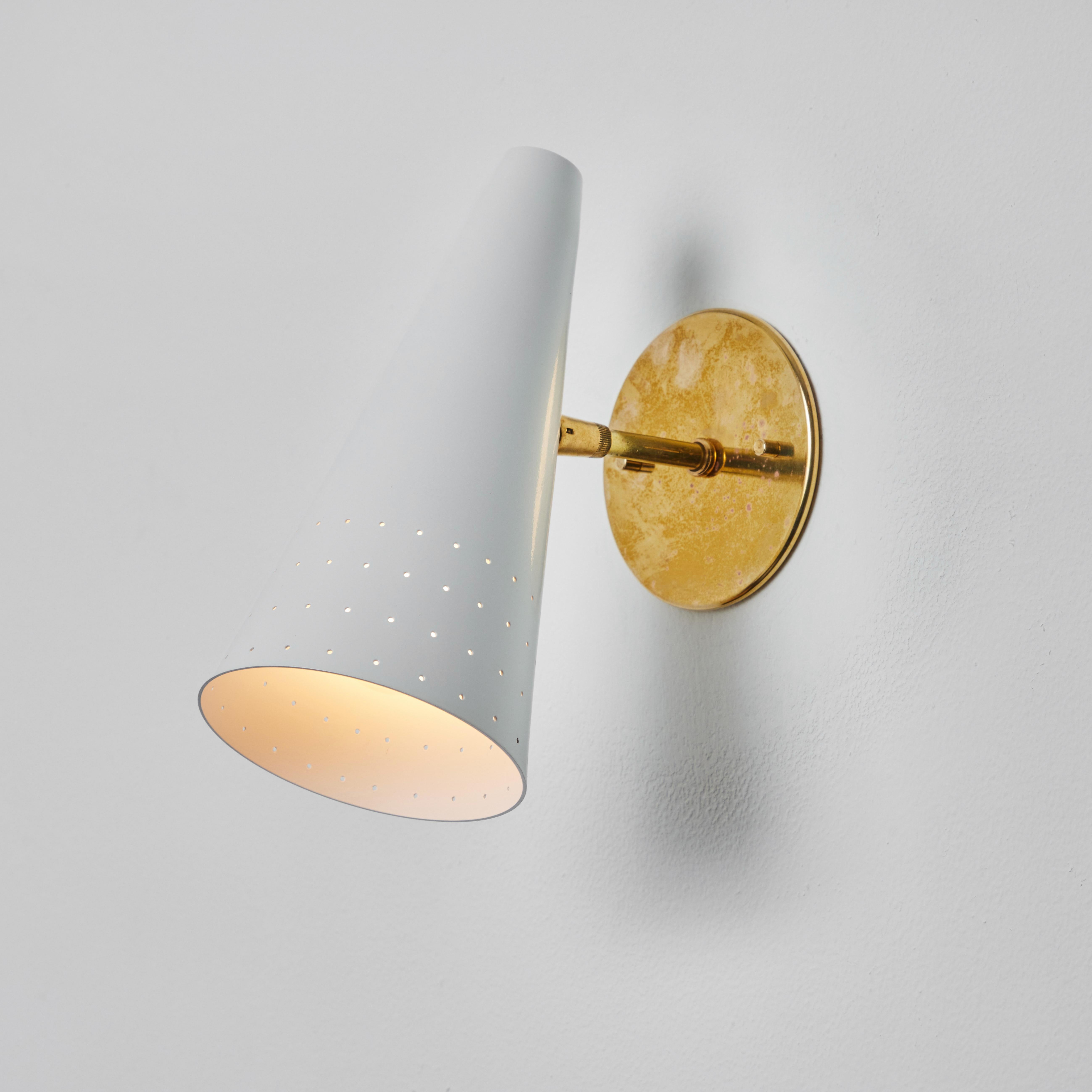 1950s Italian white perforated cone sconce attributed to Gino Sarfatti. Executed in brass and white painted aluminum. 

Arteluce was one of the most innovative lighting design companies in Italy during the midcentury era, with Sarfatti their